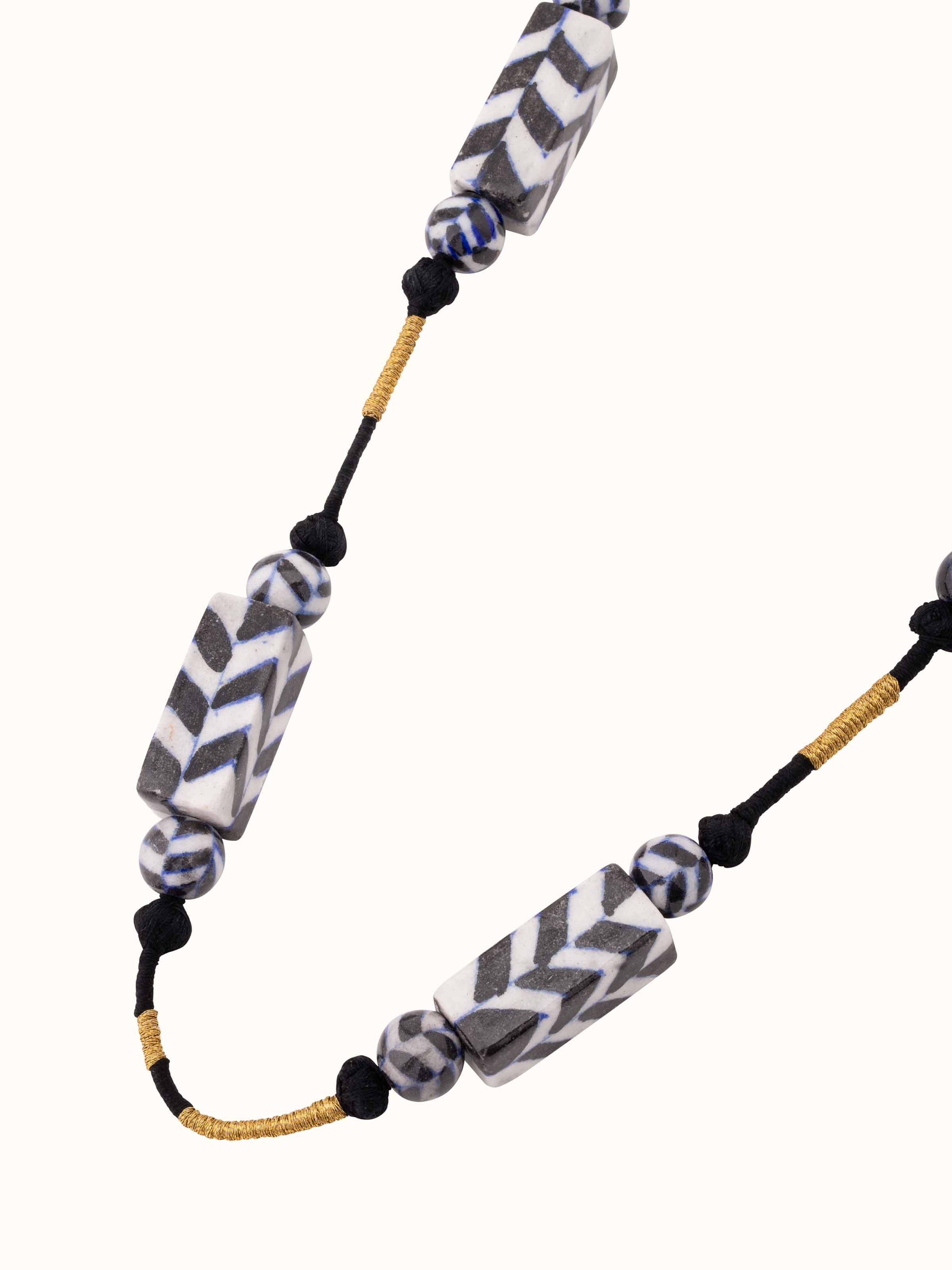 Angled view of Blue pottery long necklace showcasing its distinctive design and high-quality craftsmanship