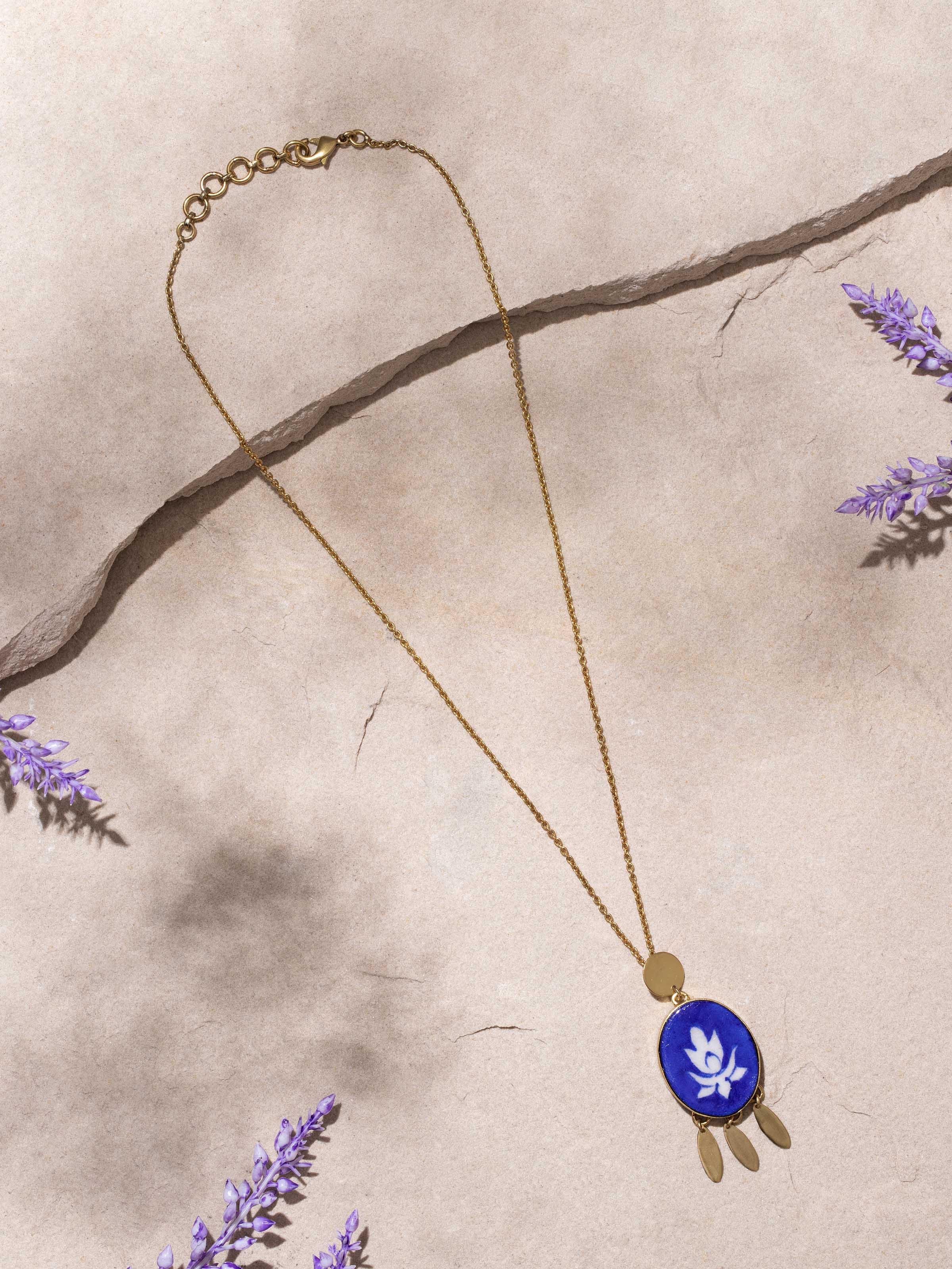 Close-up of Blue Pottery Pendant and Chain displaying the intricate blue pottery design and fine craftsmanship.