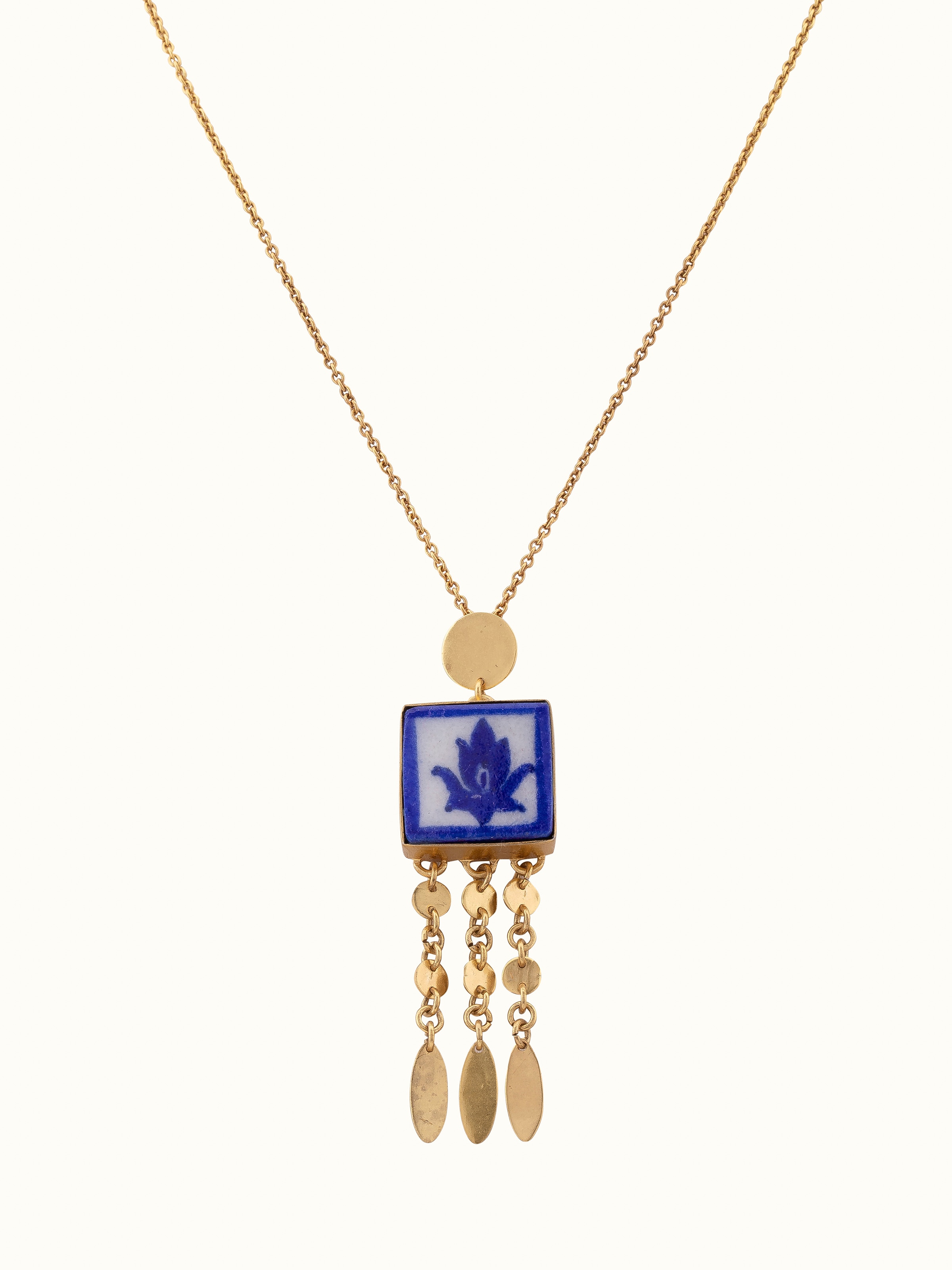 Front view of blue pottery pendant & chain showcasing vibrant color and design.