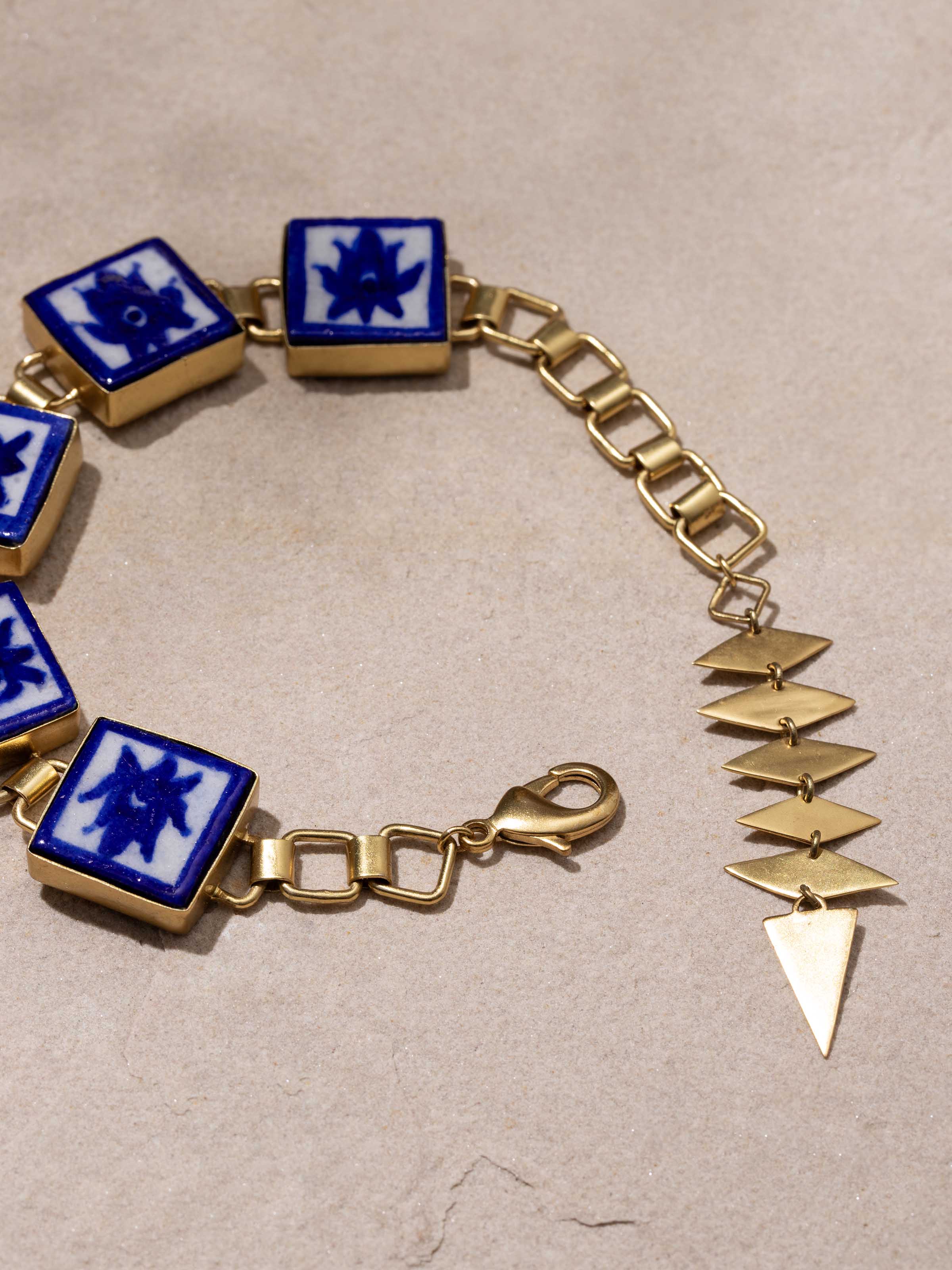 Angled view of Blue Pottery Flexible Bracelet emphasizing ceramic craftsmanship.