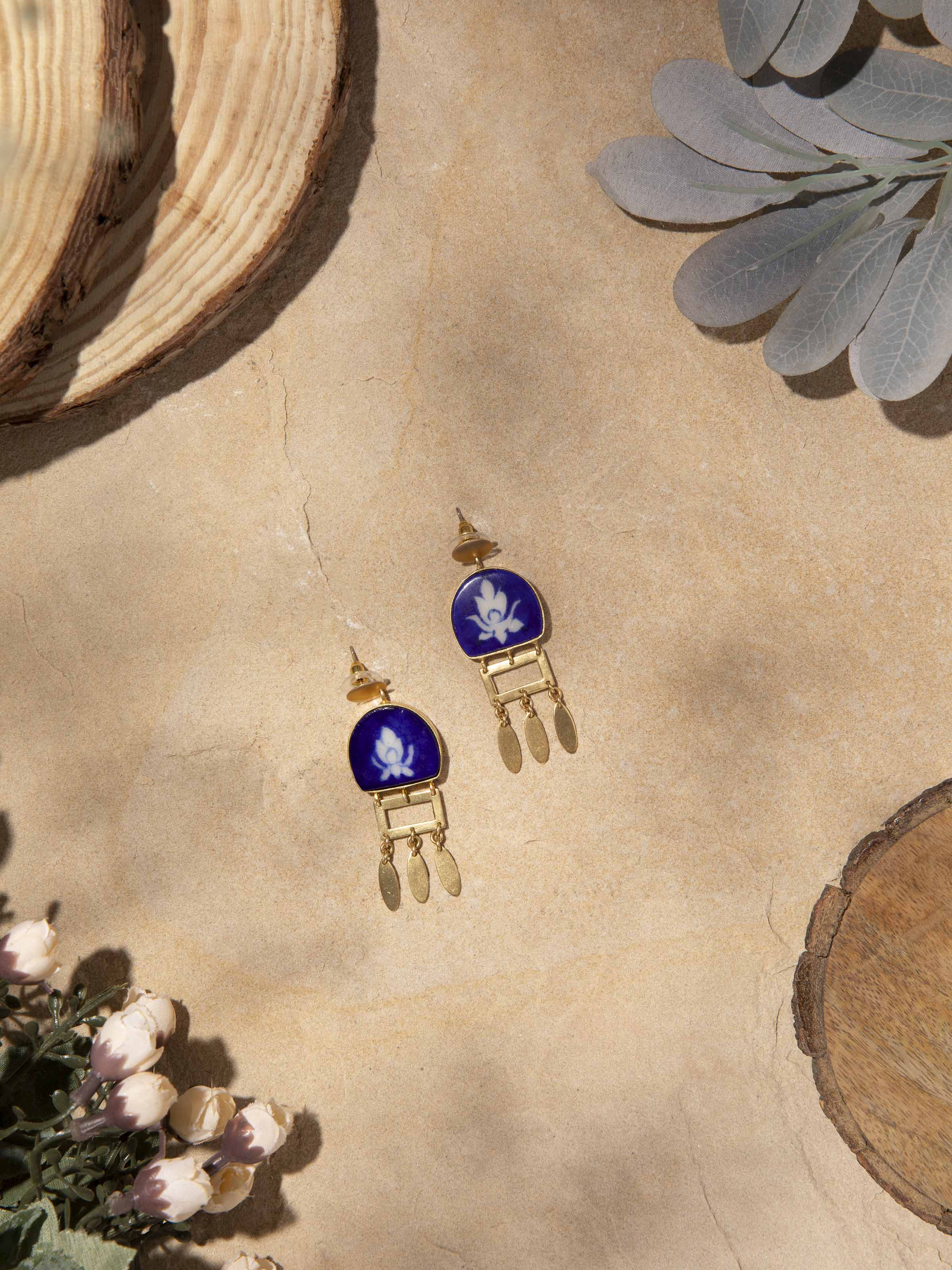 Close-up of Blue Pottery Drop Earrings featuring detailed floral patterns in blue pottery style.