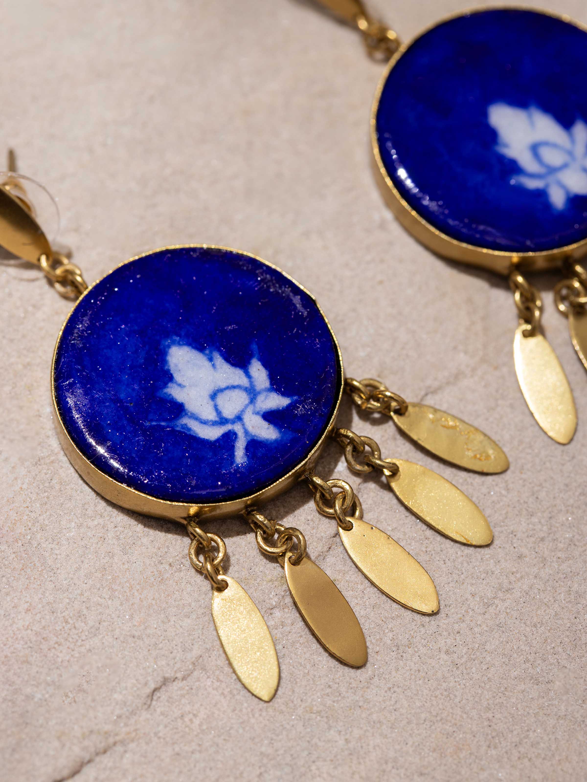 Detailed shot of Blue pottery drop earrings displaying craftsmanship and design