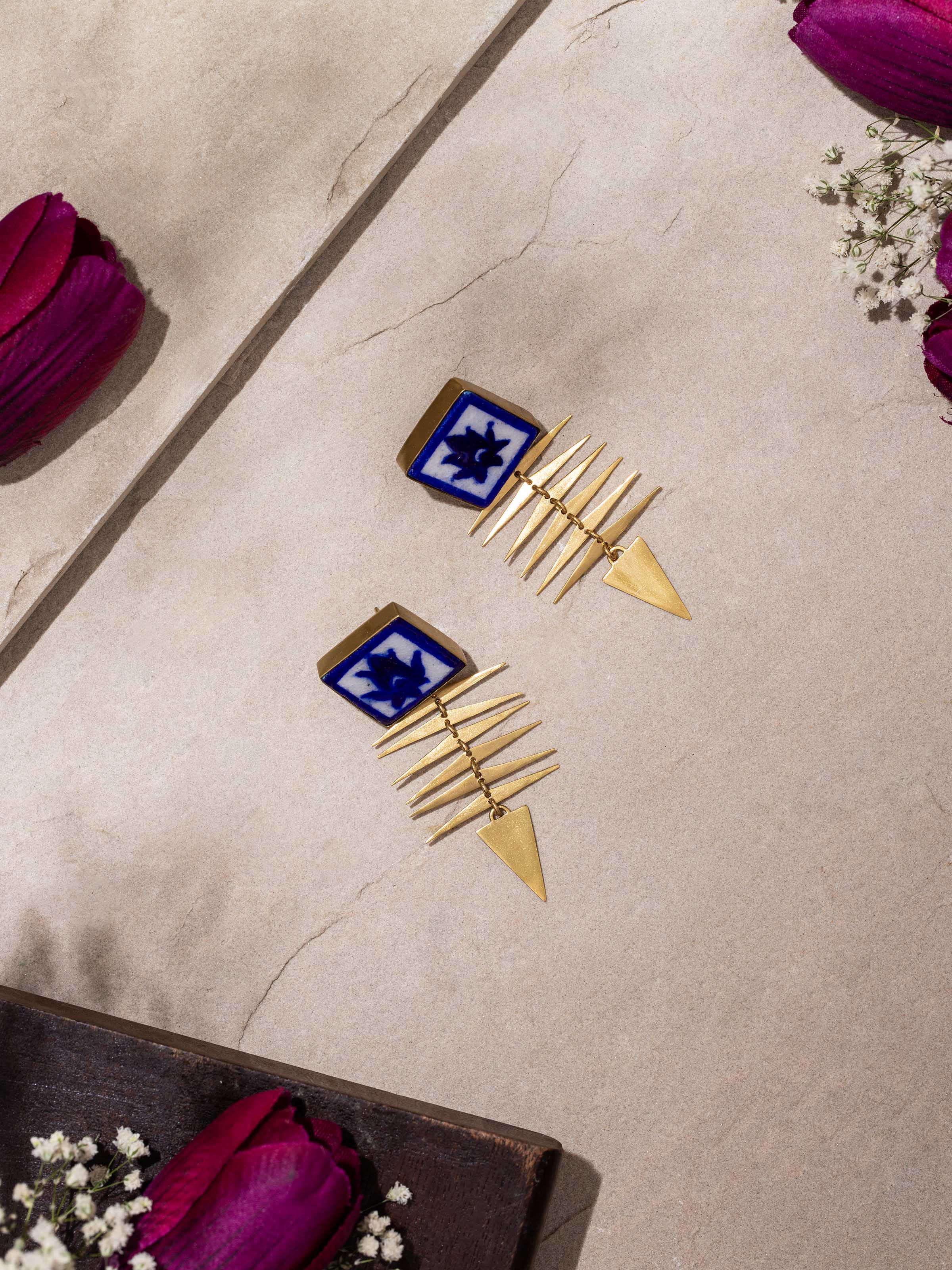Side view of Blue Pottery Drop Earrings highlighting the elegant drop design and vibrant blue pottery.