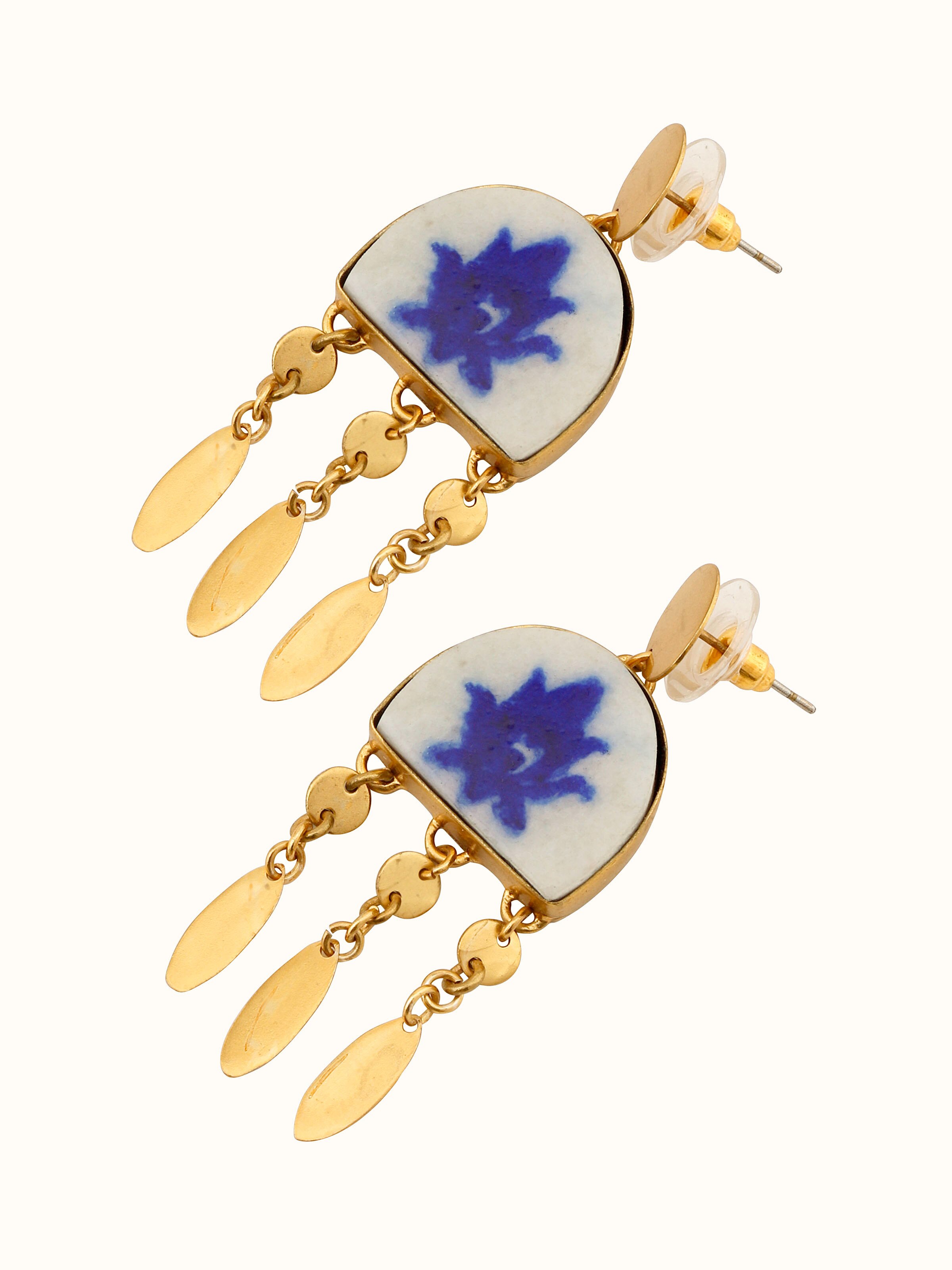 Detailed close-up of blue pottery drop earrings focusing on the artistic designs and fine details.