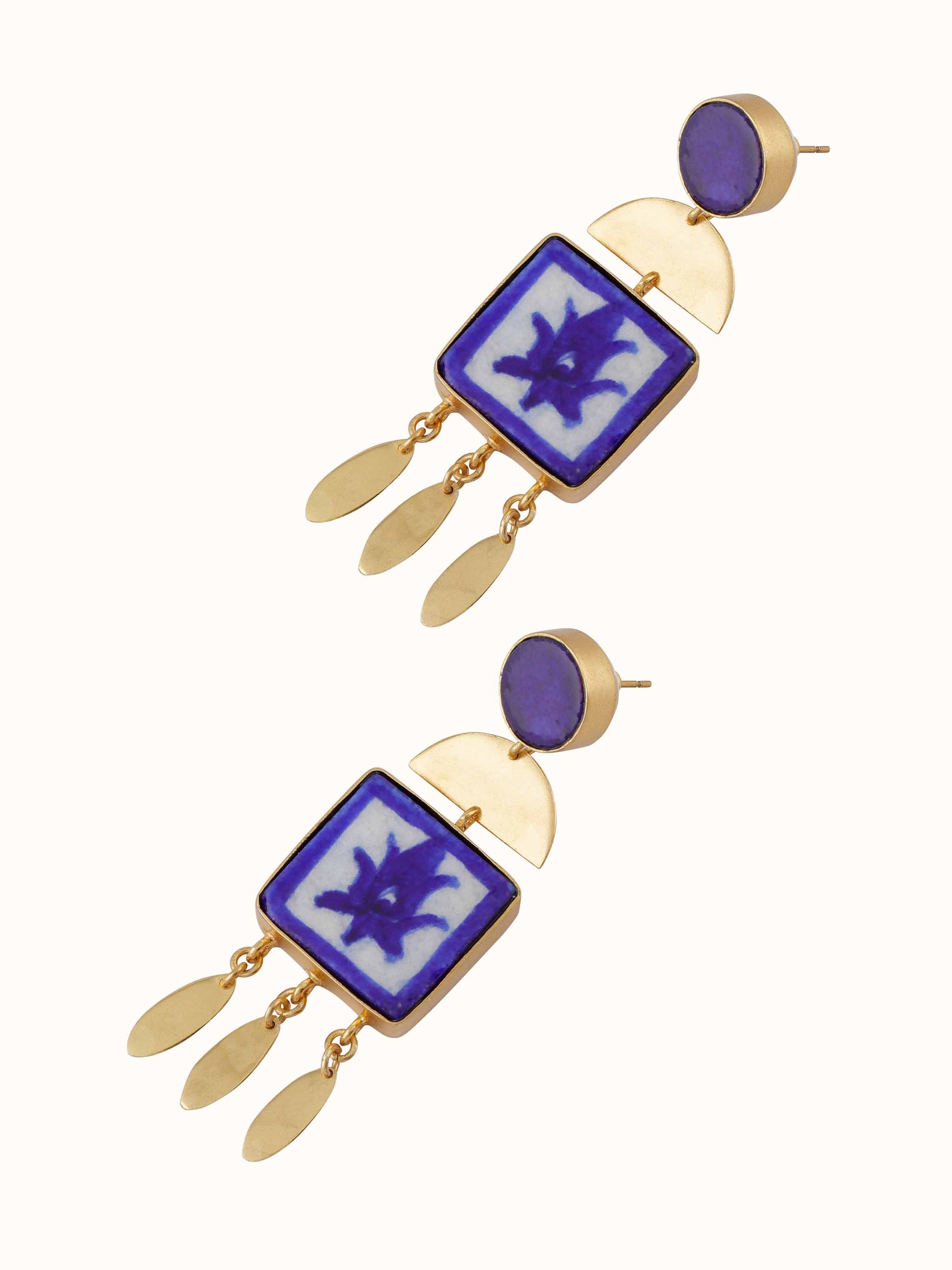 Angled view of blue pottery drop earrings highlighting the craftsmanship and design