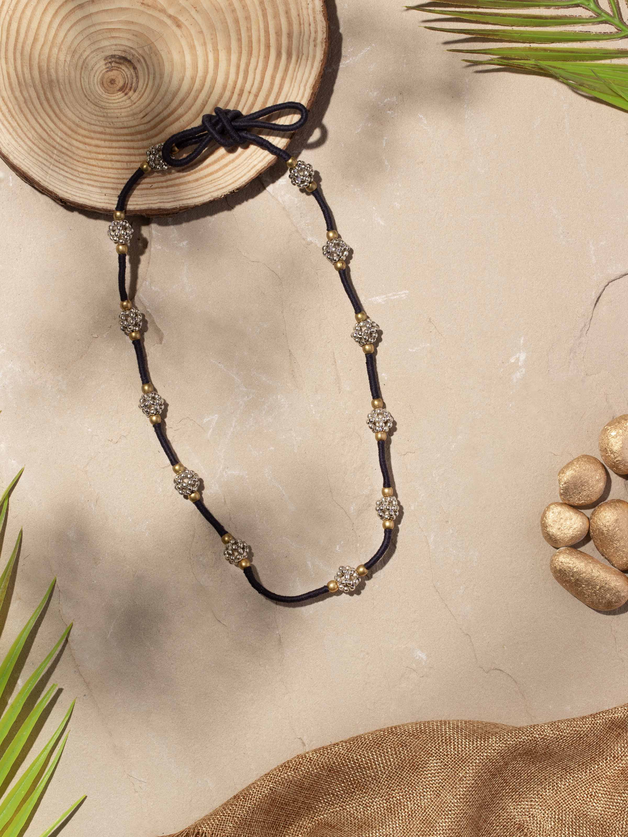 Close-up view of Lambani long necklace emphasizing the intricate beadwork and traditional patterns.