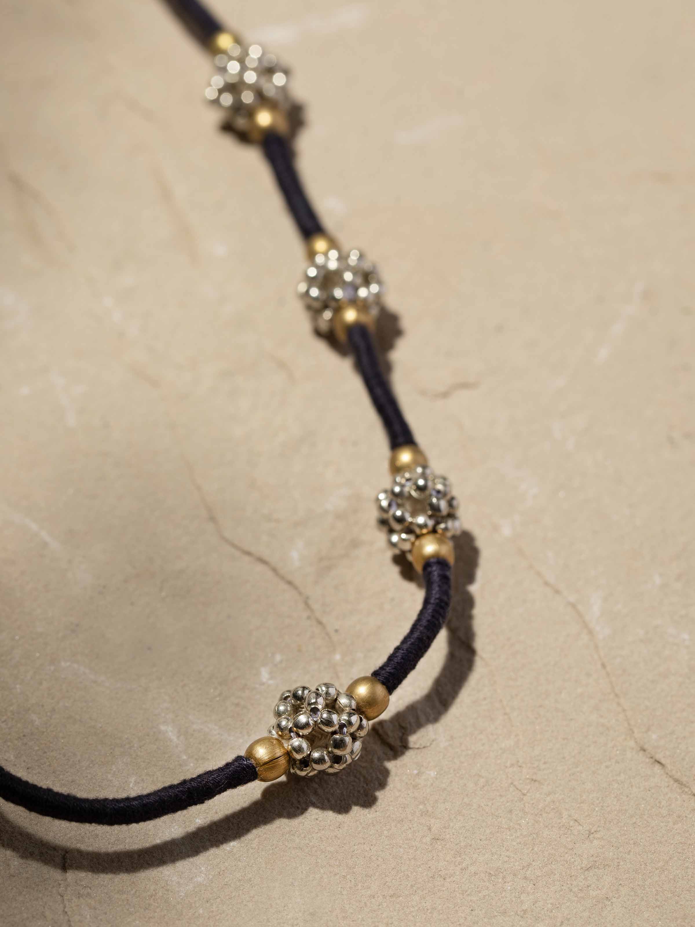 Detailed close-up of Lambani long necklace showcasing the texture and beadwork in the design.
