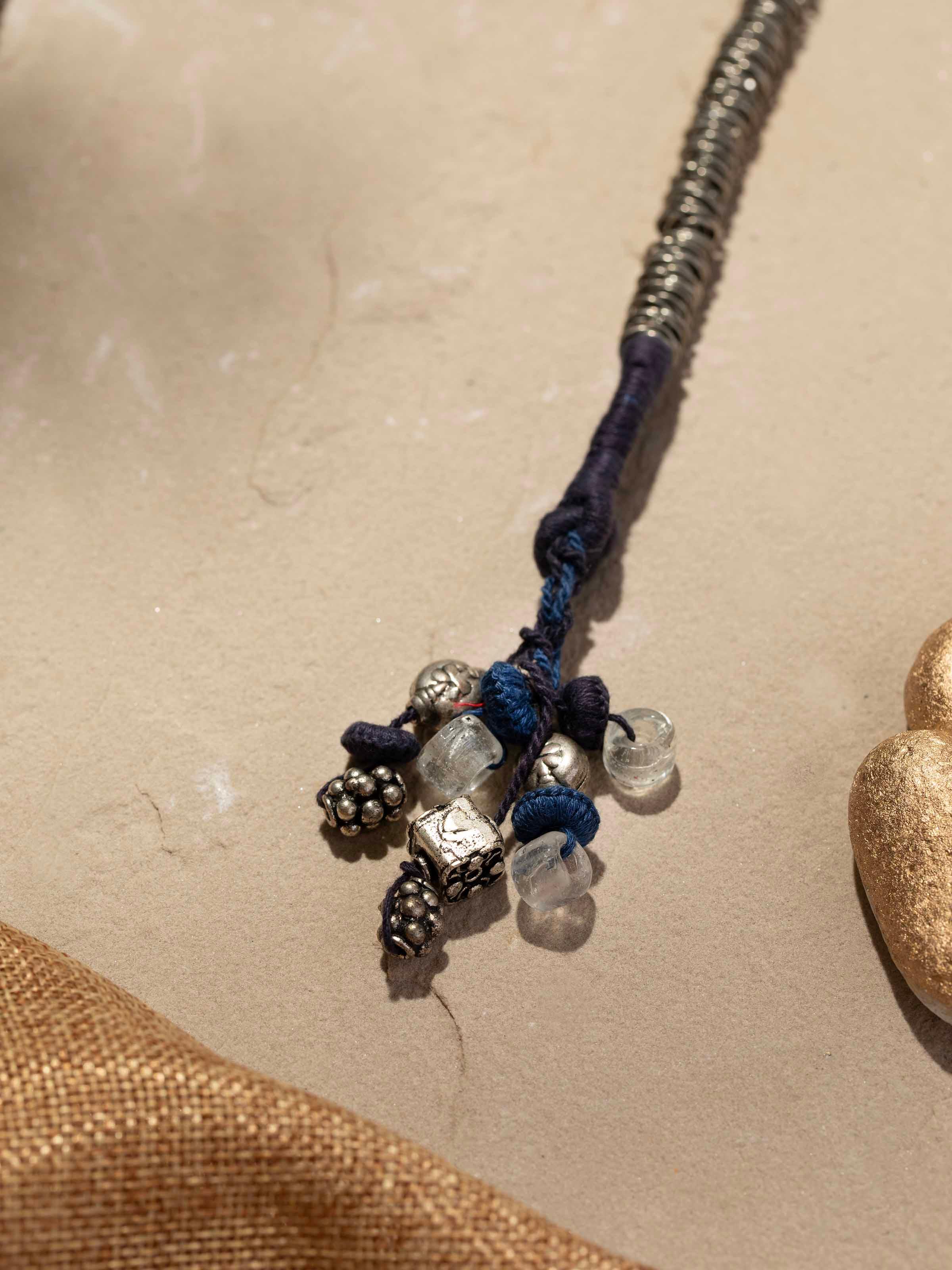Back view of Thappa 22 karat gold drop earrings showing the secure clasp and overall design.
