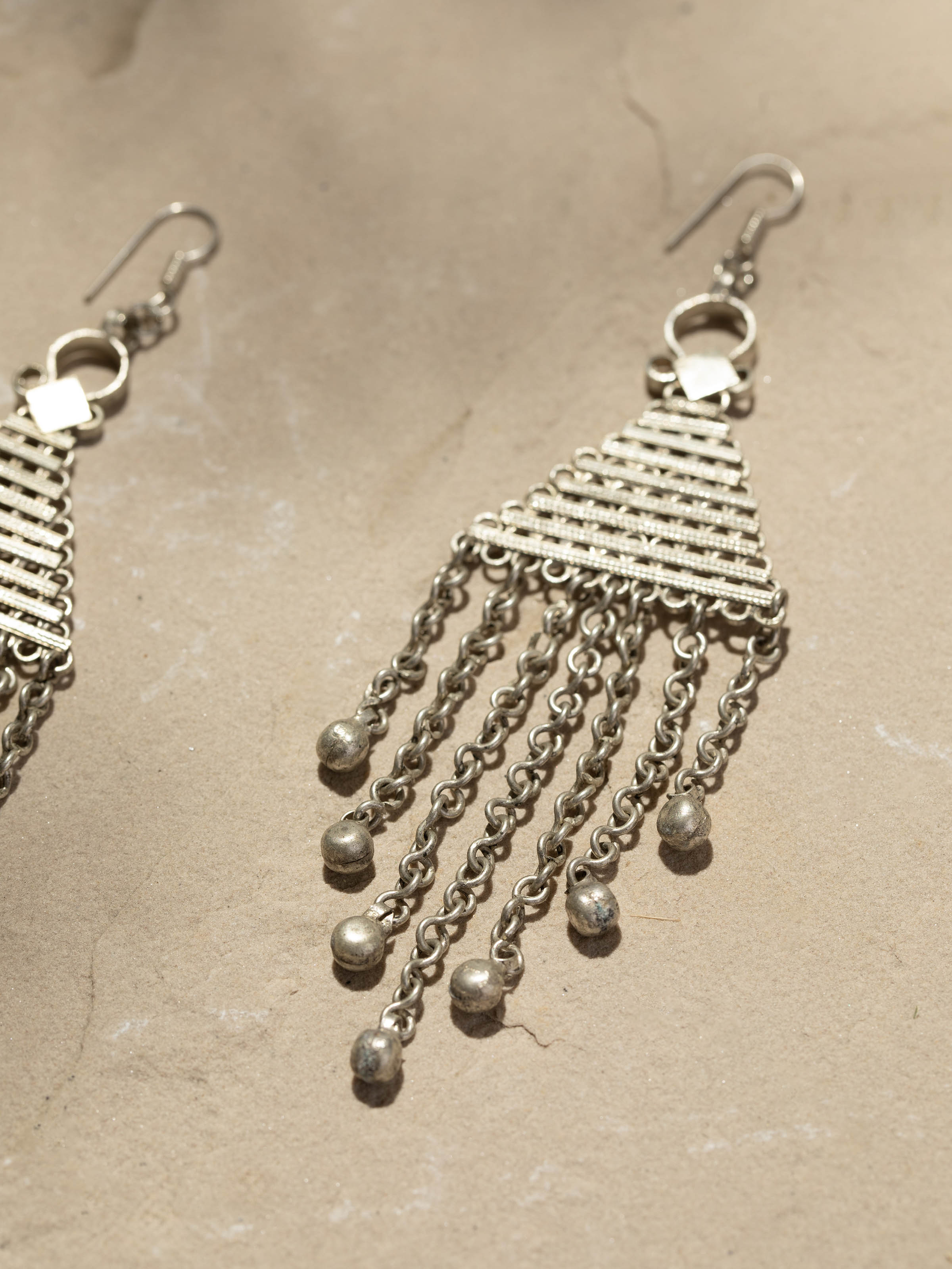 Back view of Lambani earrings showing the secure clasp and traditional design elements.