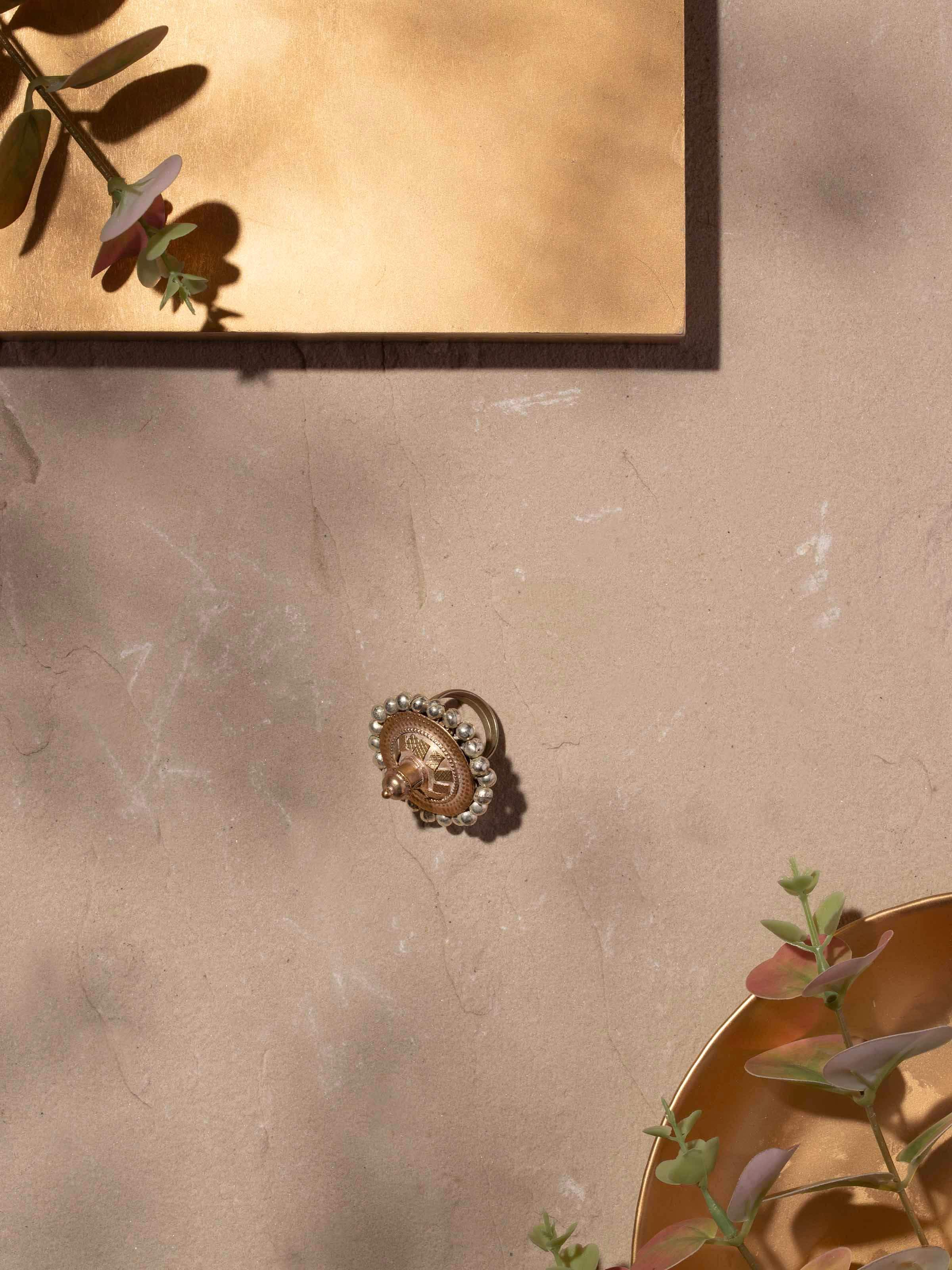 Close-up view of Lambani Ring revealing intricate metal details and colorful embellishments.