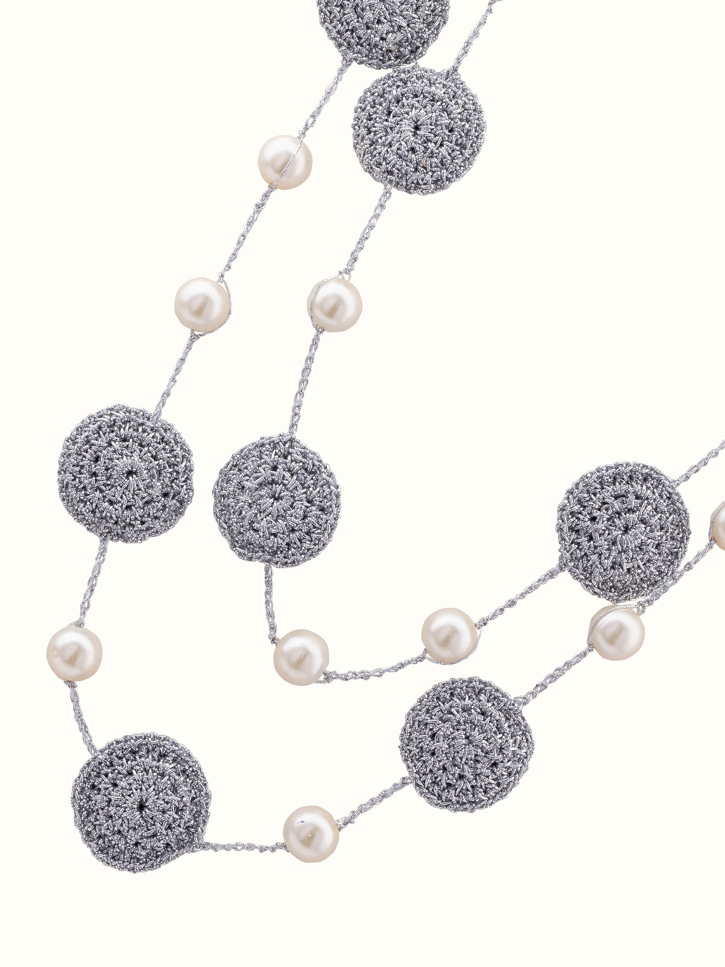 Angled view of Crochet Long Necklace showcasing refined design and craftsmanship.