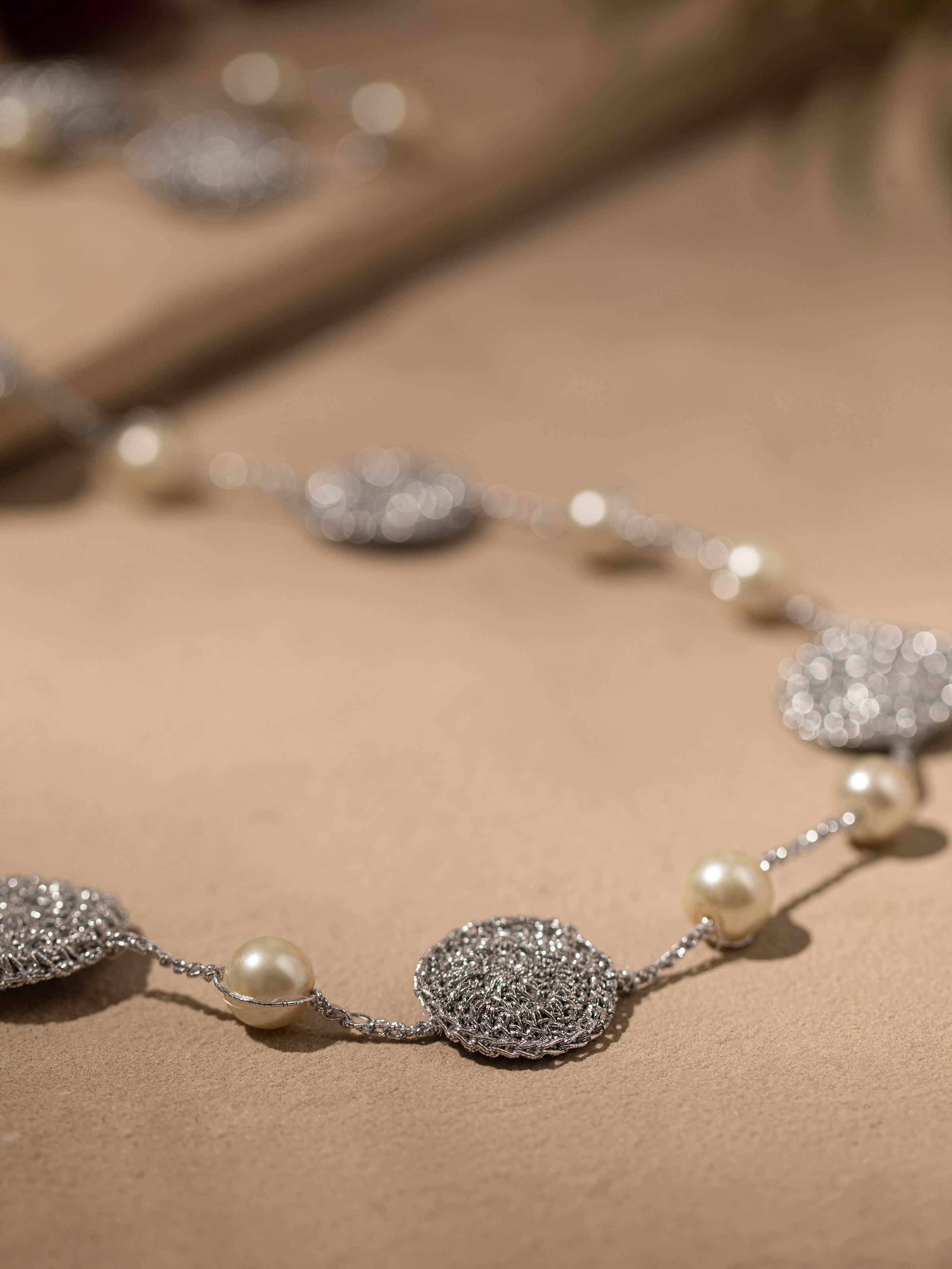 Back view of Crochet Long Necklace showing clasp and crochet pattern.