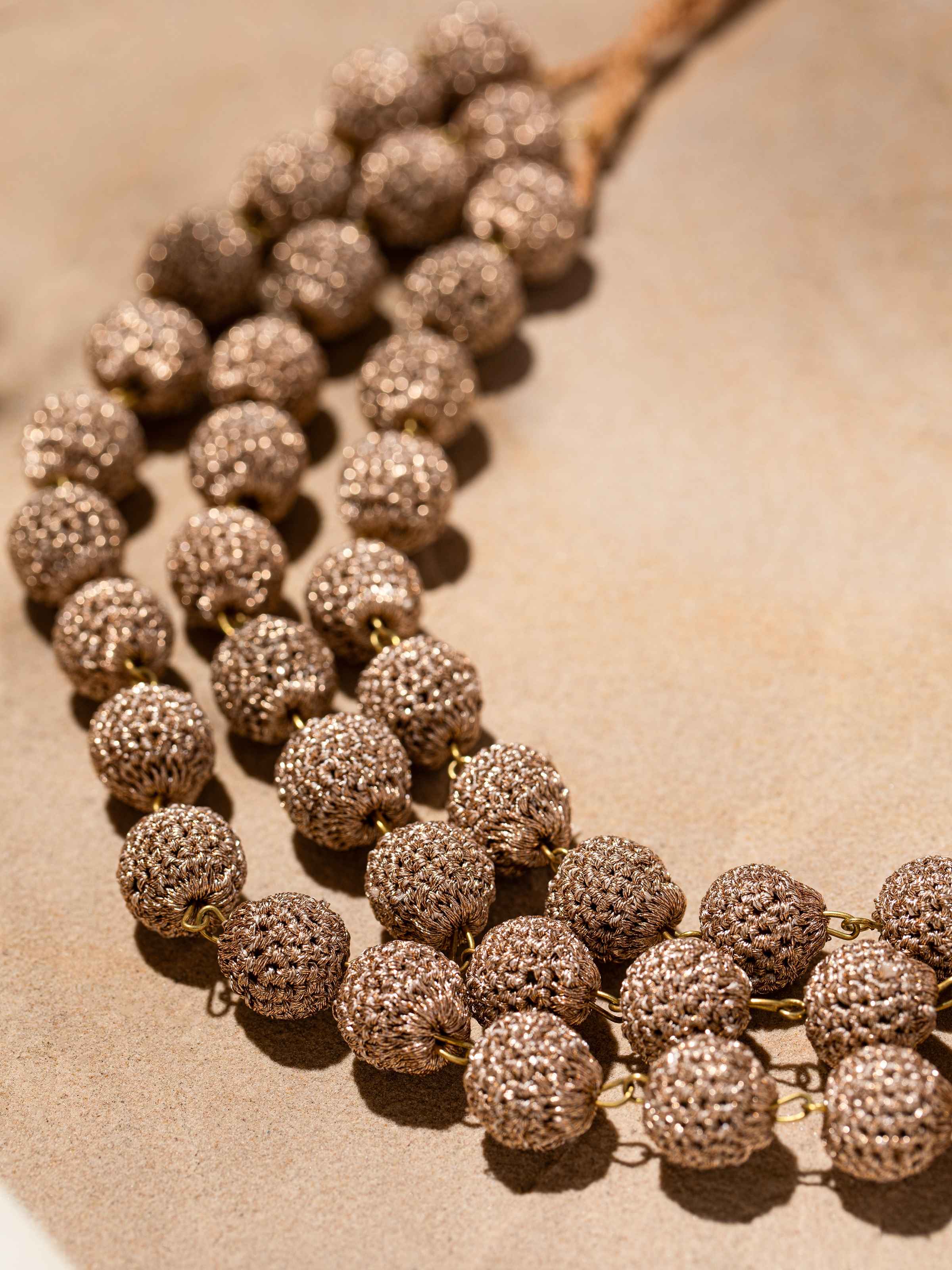 Back view of Crochet Long Necklace displaying the clasp and overall design.