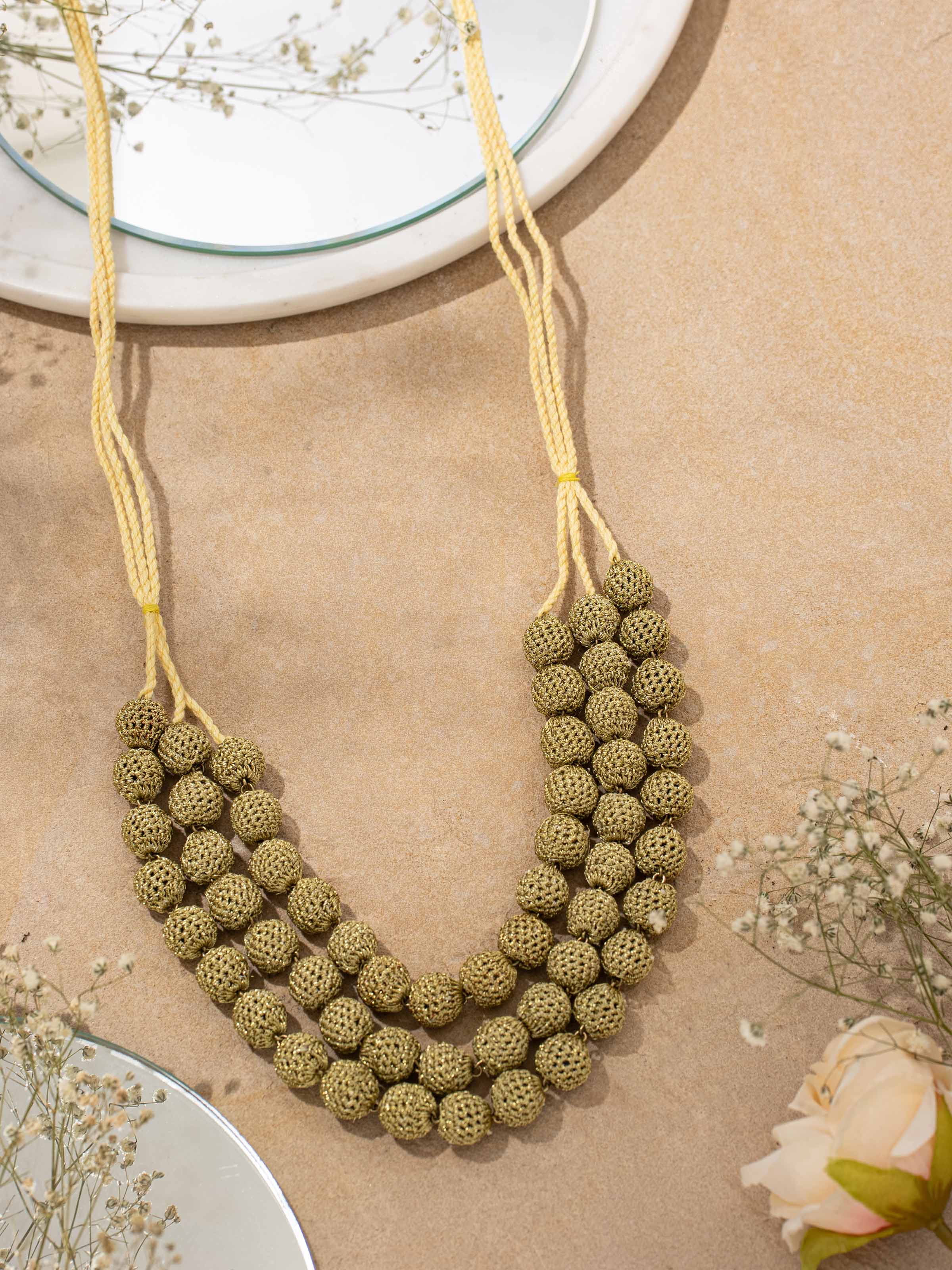 Side view of Crochet Long Necklace highlighting the intricate crochet work and length.