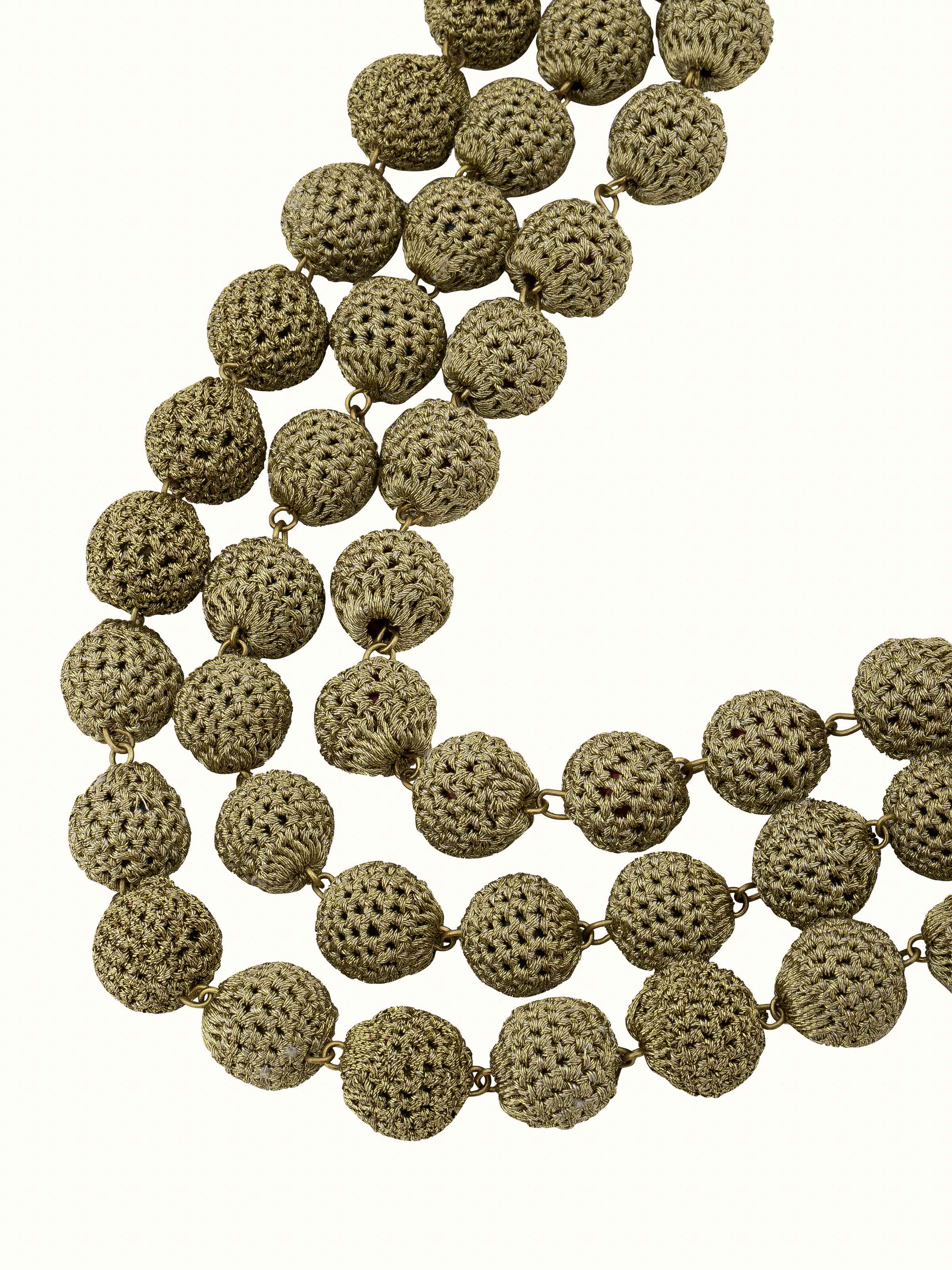 Angled view of Crochet Long Necklace to highlight its stylish and elaborate design.