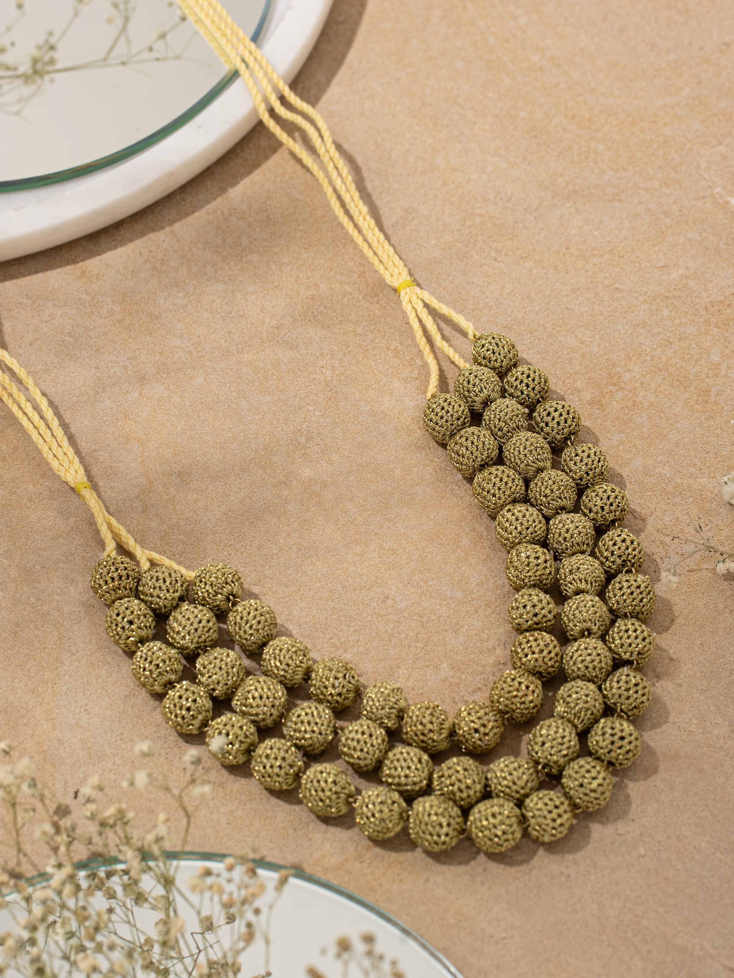 Detailed view of Crochet Long Necklace from a distance showing its full length and crochet details.