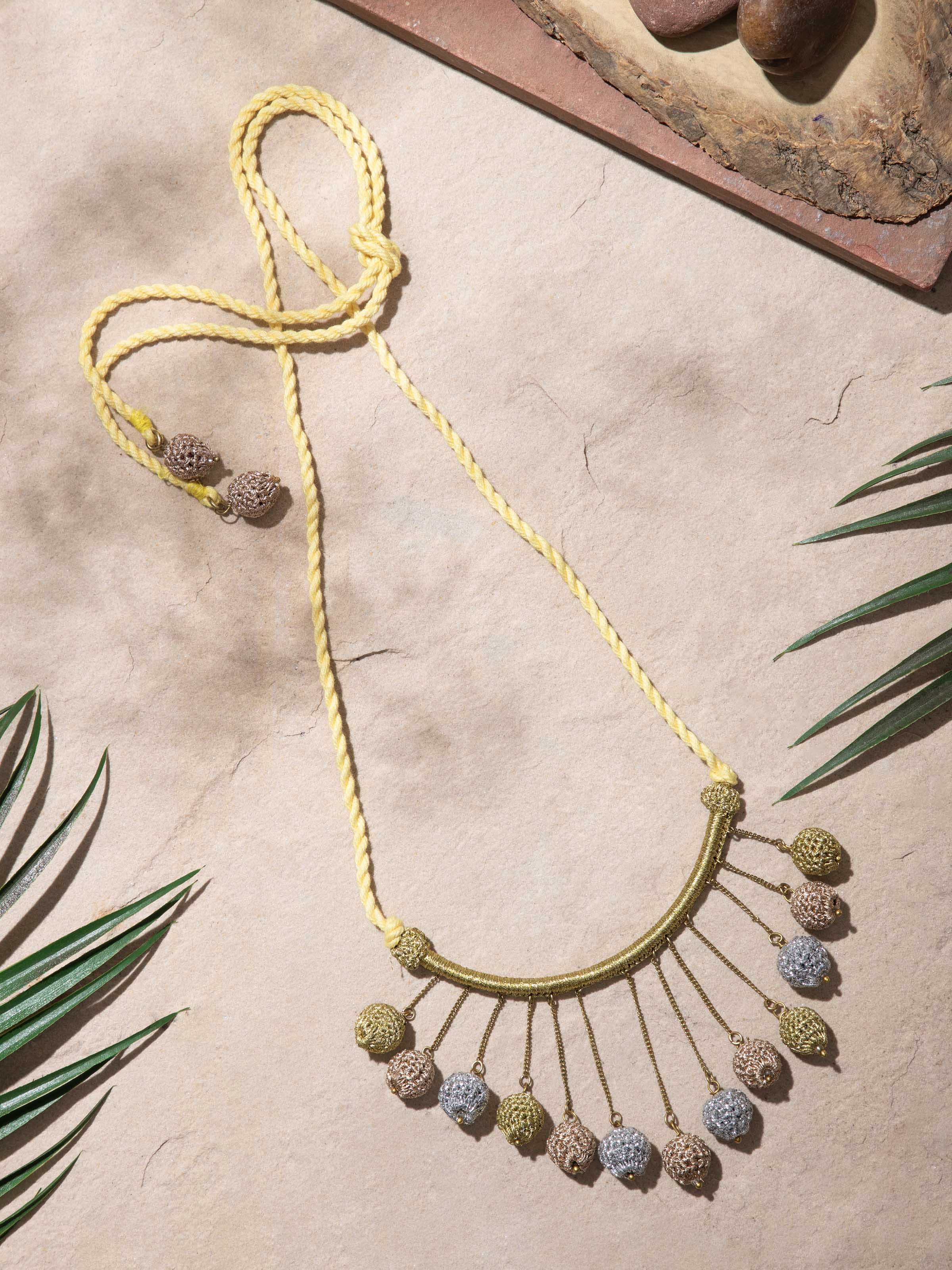 Close-up of Crochet long necklace focusing on the craftsmanship and detailed crochet work.