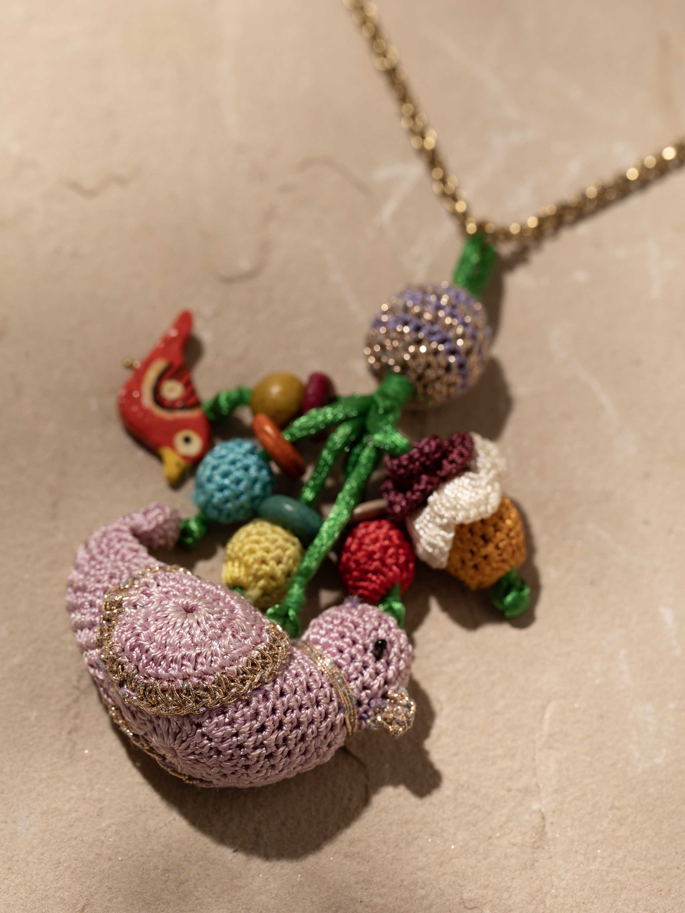 Detailed view of Crochet Pendant with Chain, featuring craftsmanship