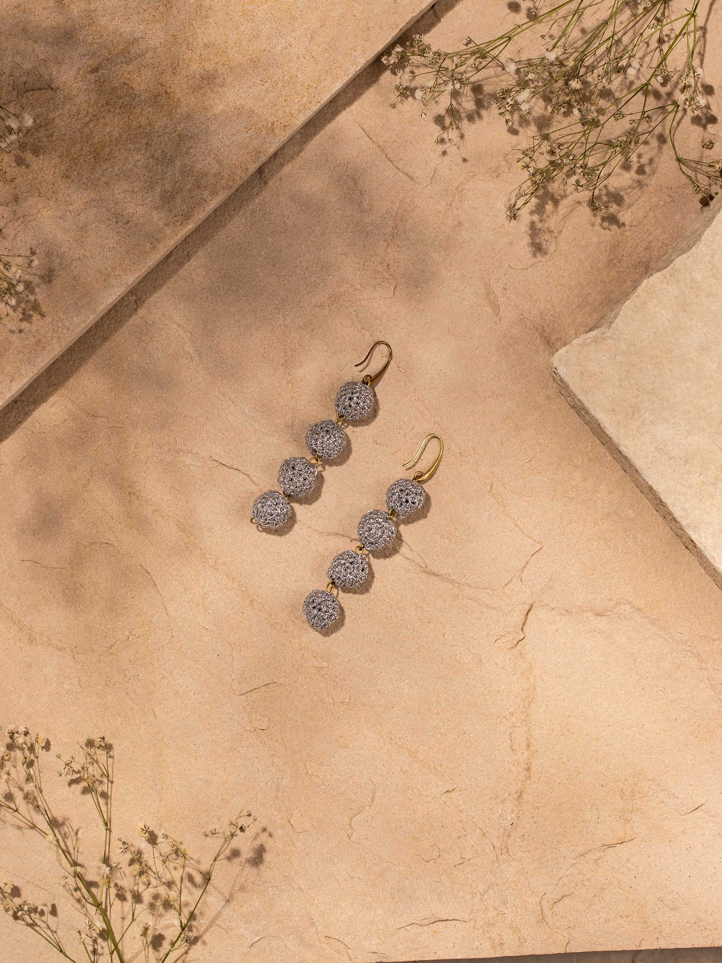 Side view of Crochet Drop Earrings showcasing the detailed crochet pattern and elegant drop design.