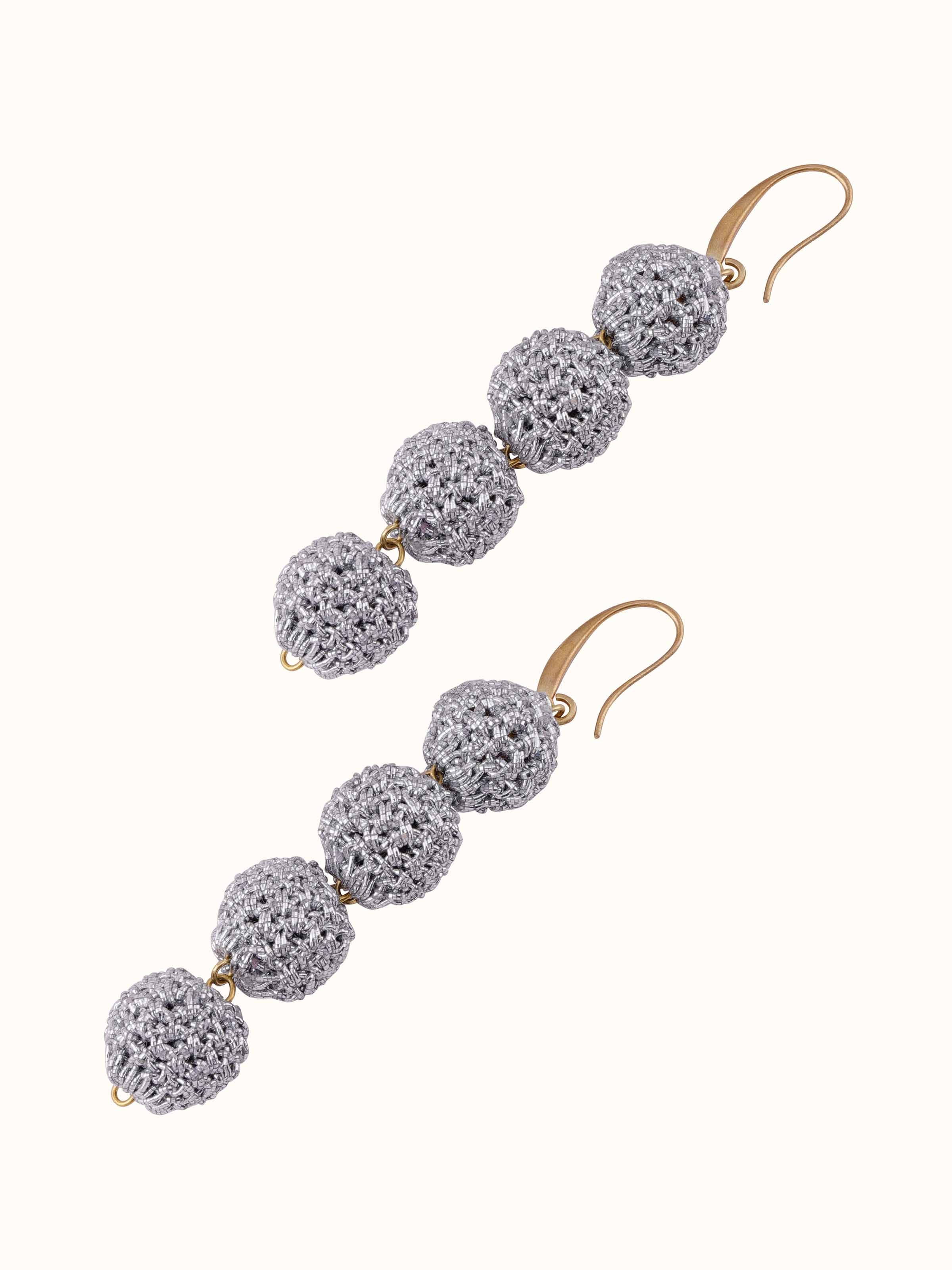 Angled view of Crochet Drop Earrings emphasizing the sophisticated crochet craftsmanship and design.