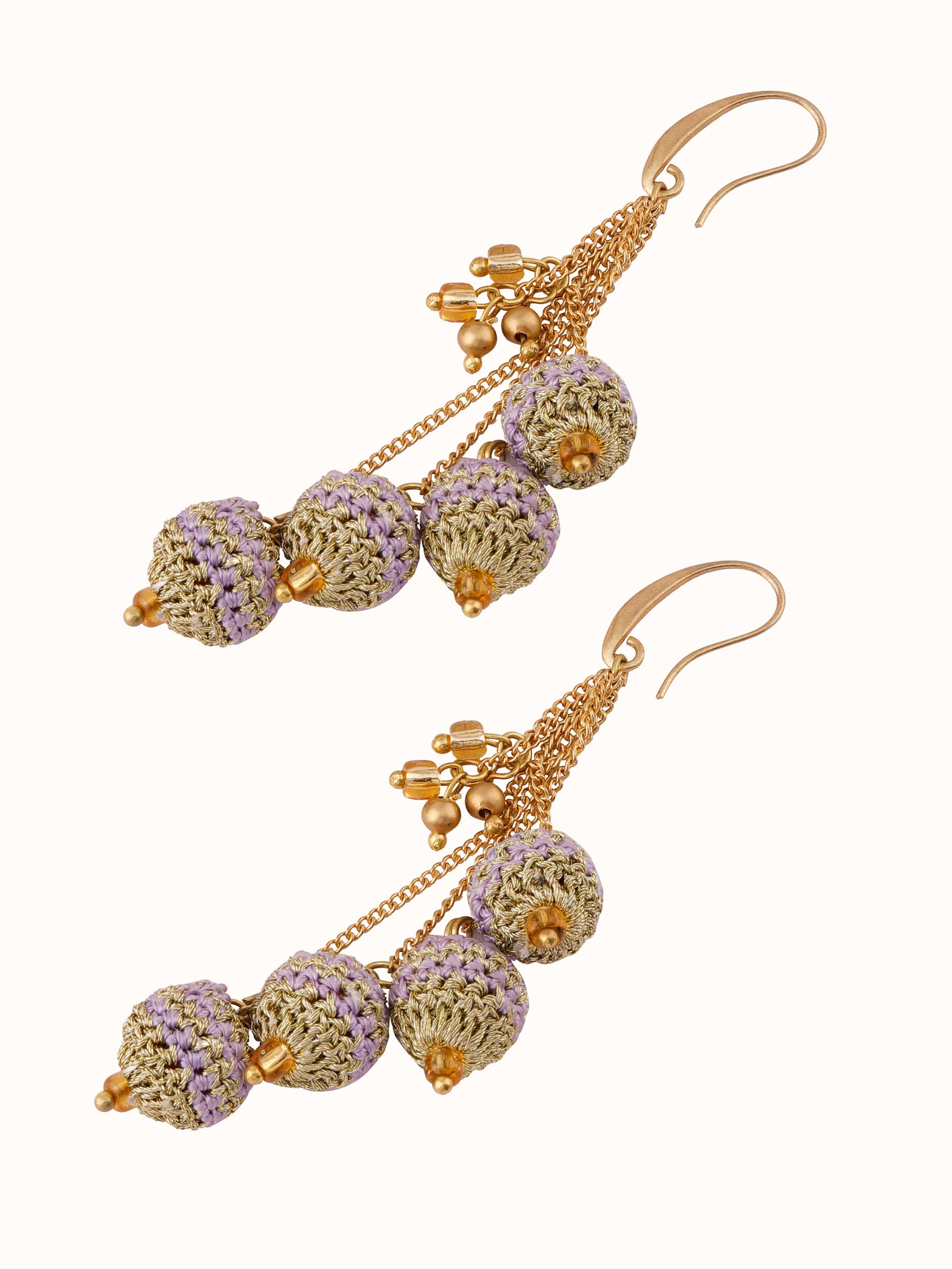 Angled view of Crochet Drop Earrings showcasing their stylish crochet pattern and beads.