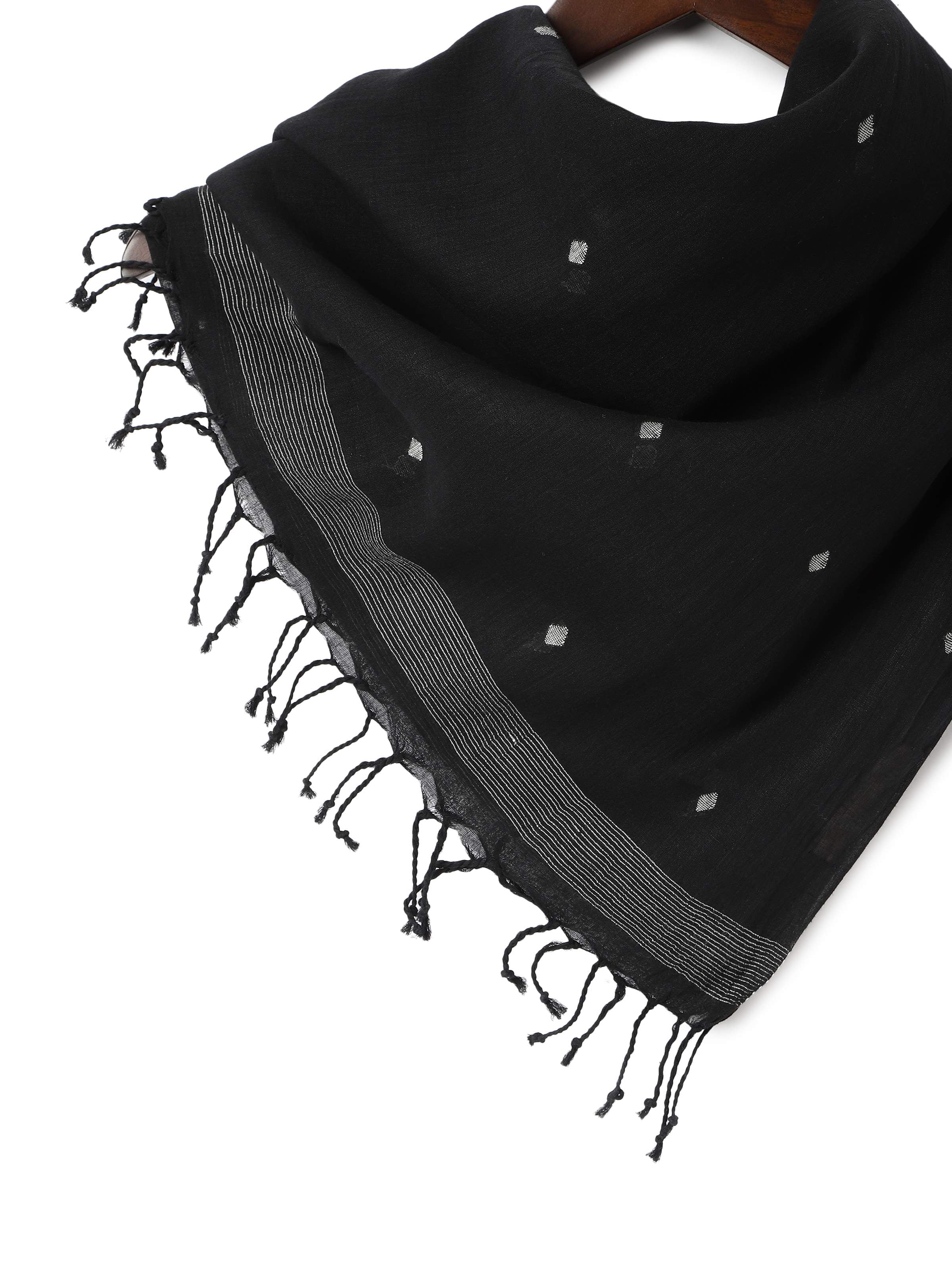 Detail view showing texture and edge finish of black cotton stole.