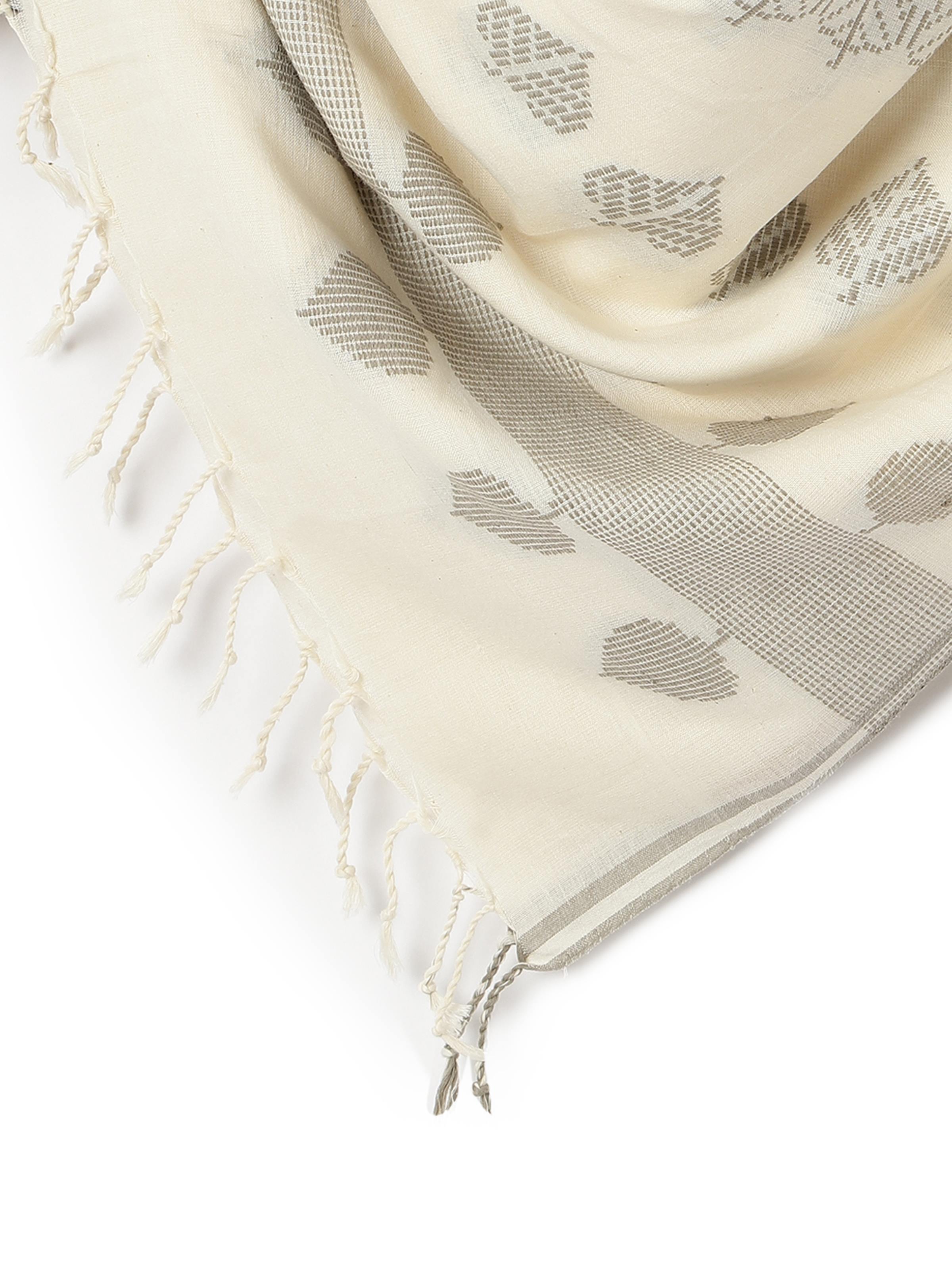 Close-up view of extra-weft weaving pattern on off-white cotton stole.