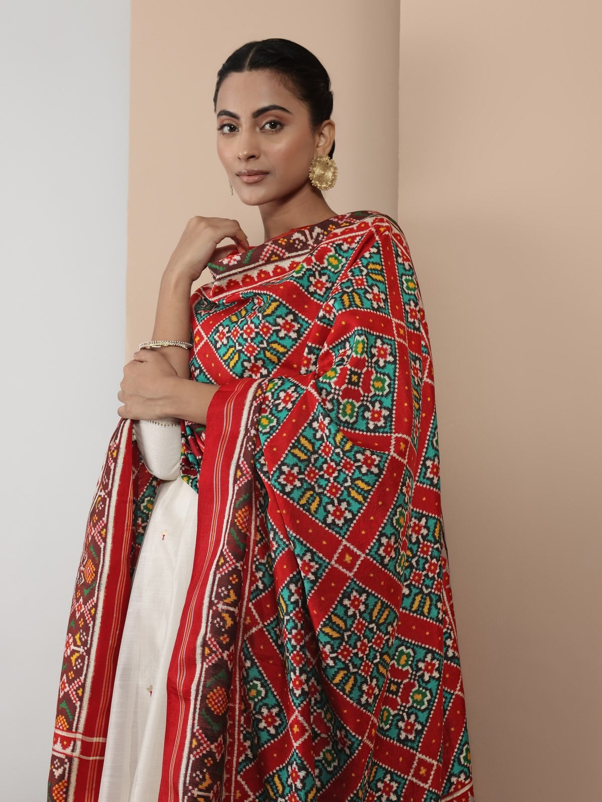 Alternate lifestyle view of red Patola silk dupatta in festive attire