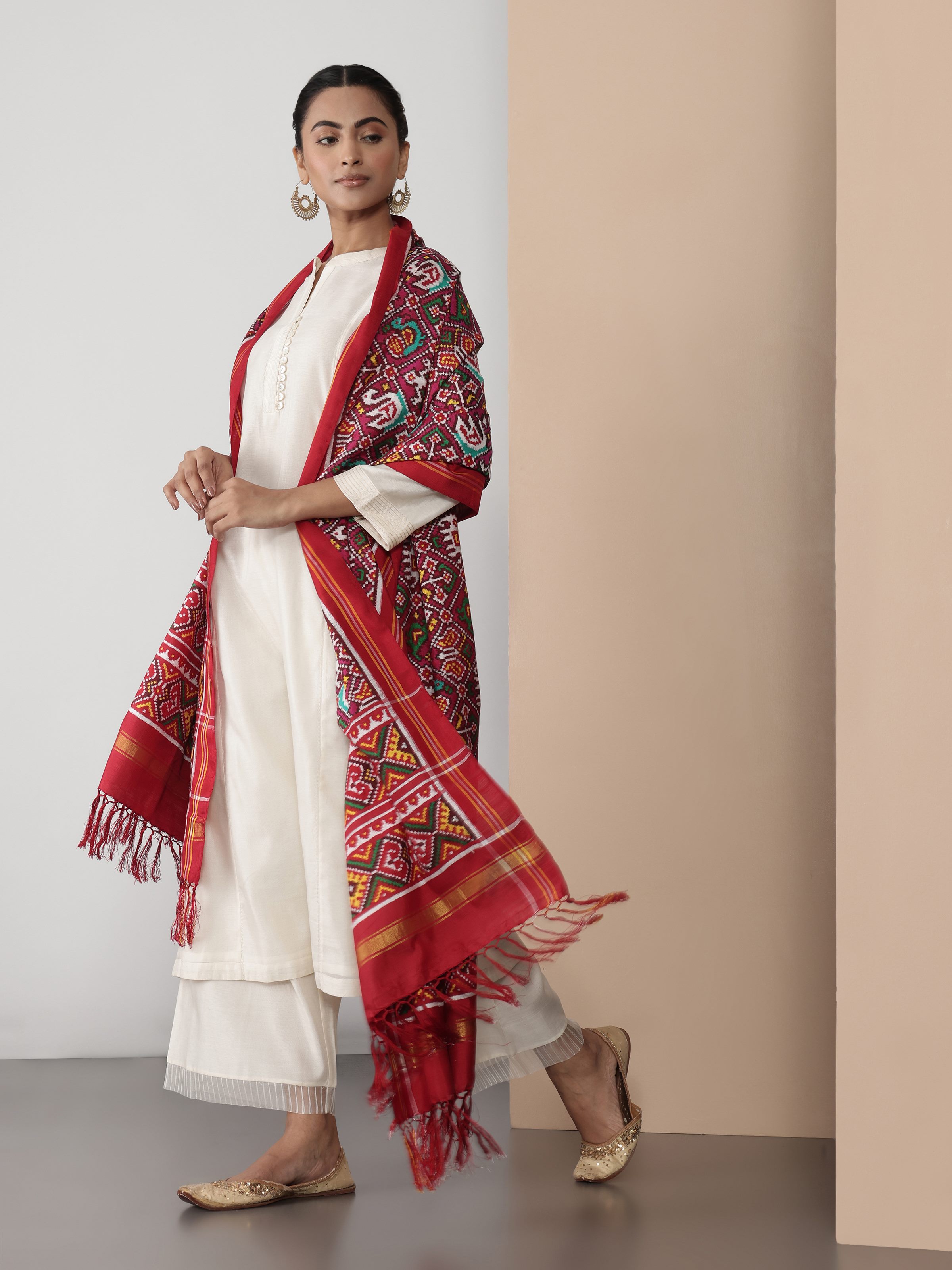 Lifestyle view of pink silk Patola Nari Kunjar dupatta draped elegantly