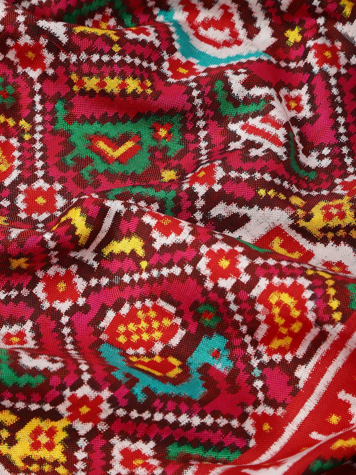 Detail view of pink silk Patola Nari Kunjar dupatta fabric texture and motifs