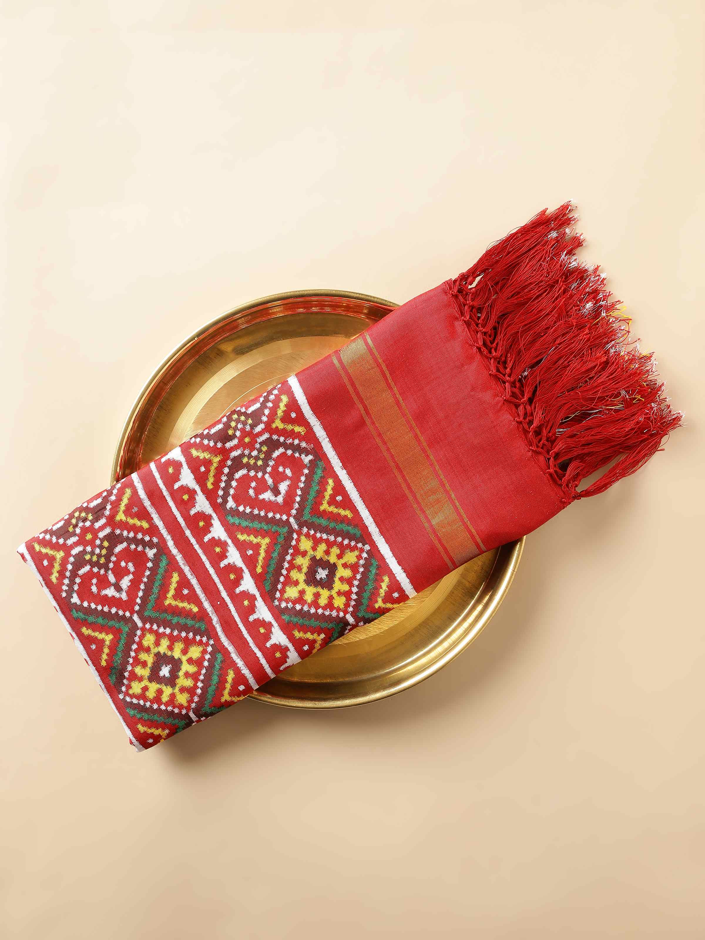 Close-up of pink Patola Nari Kunjar dupatta showing fine silk weave and pattern