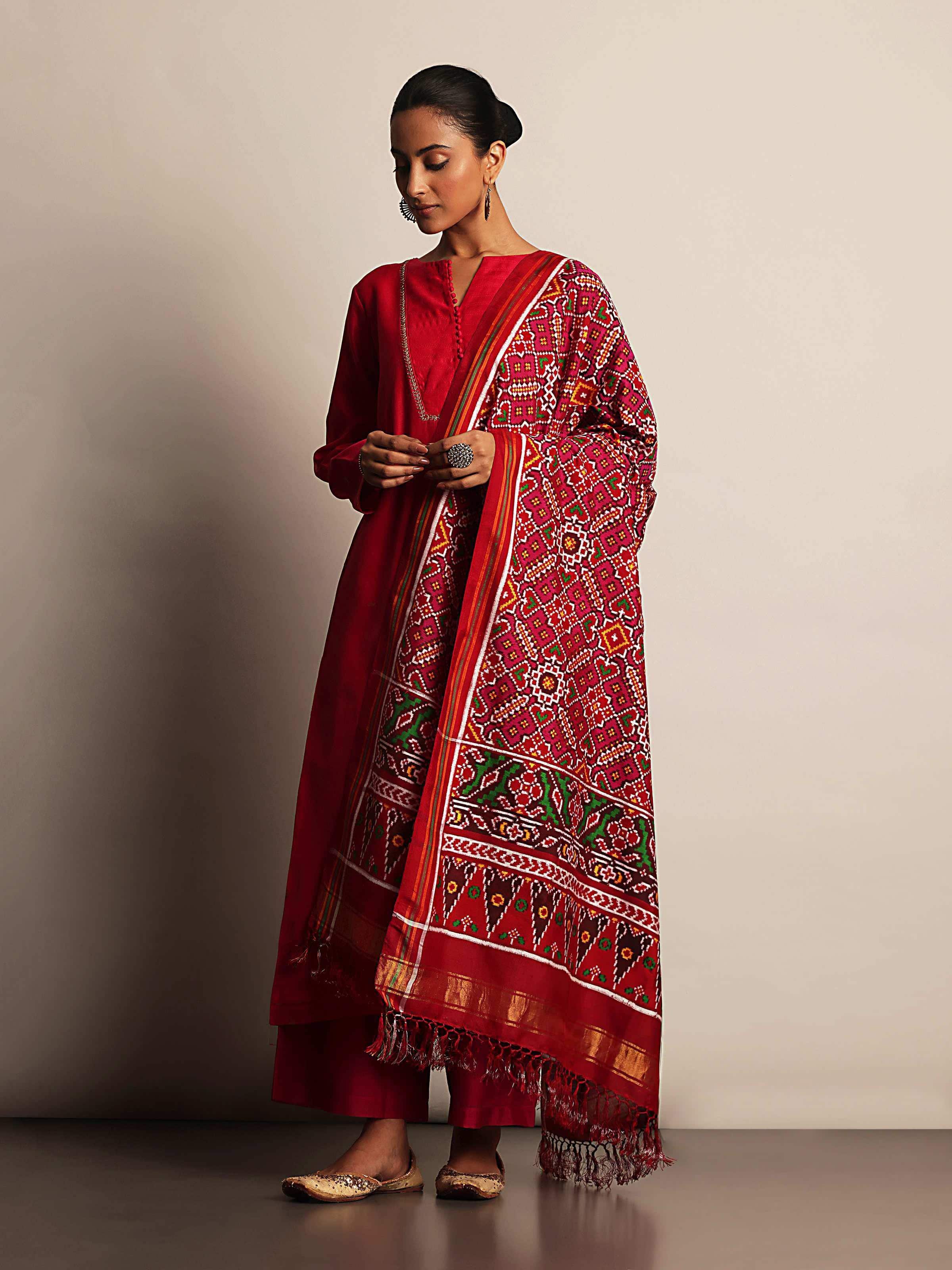 Red silk Patola Vohra Gaji dupatta lifestyle view draped on model highlighting fabric texture and shine