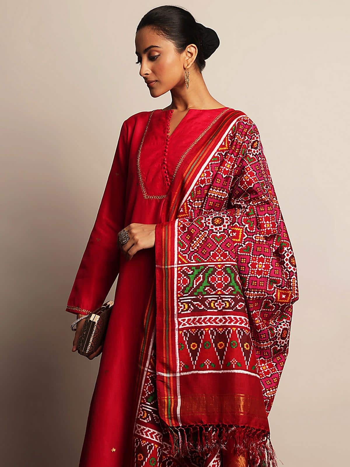 Red silk Patola Vohra Gaji dupatta angled view displaying weaving details and pattern precision