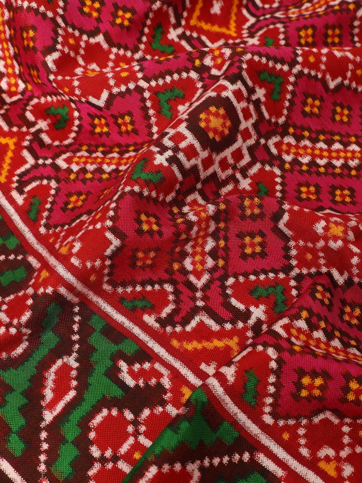 Red silk Patola Vohra Gaji dupatta detail shot focusing on handwoven motifs and silk quality