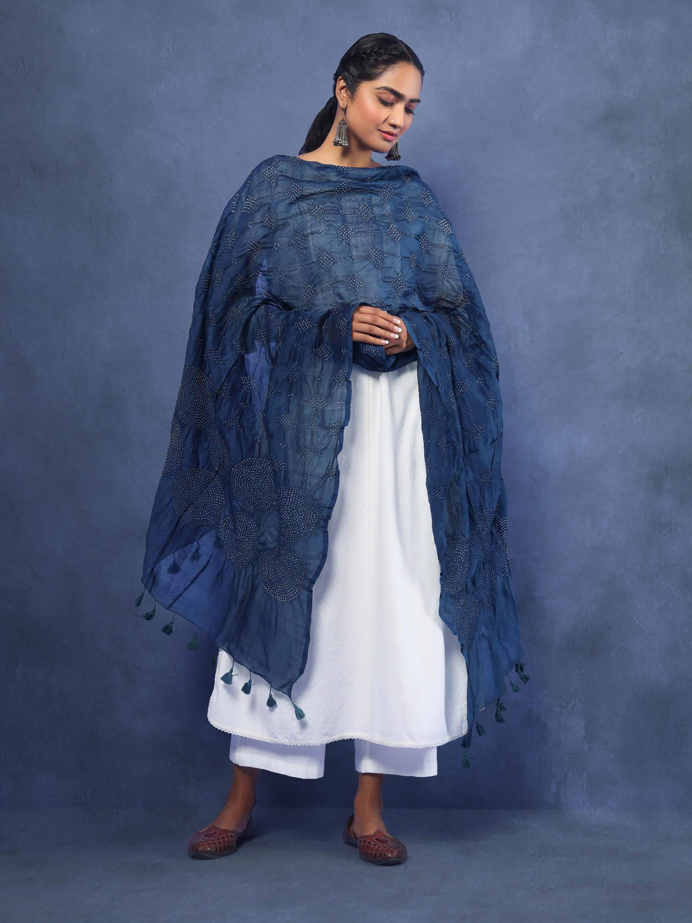 Model wearing indigo Bandhani cotton dupatta, styled over ethnic attire, showing the vibrant tie-dye design.
