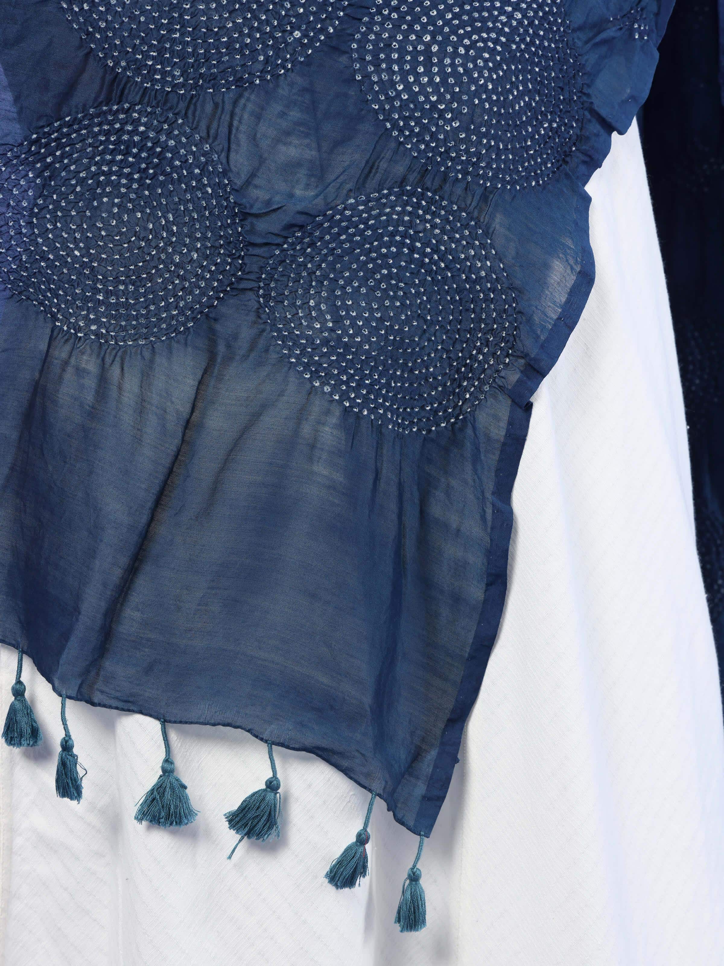 Draped side view of indigo cotton Bandhani dupatta, showing flowing fabric and intricate dotted motifs.