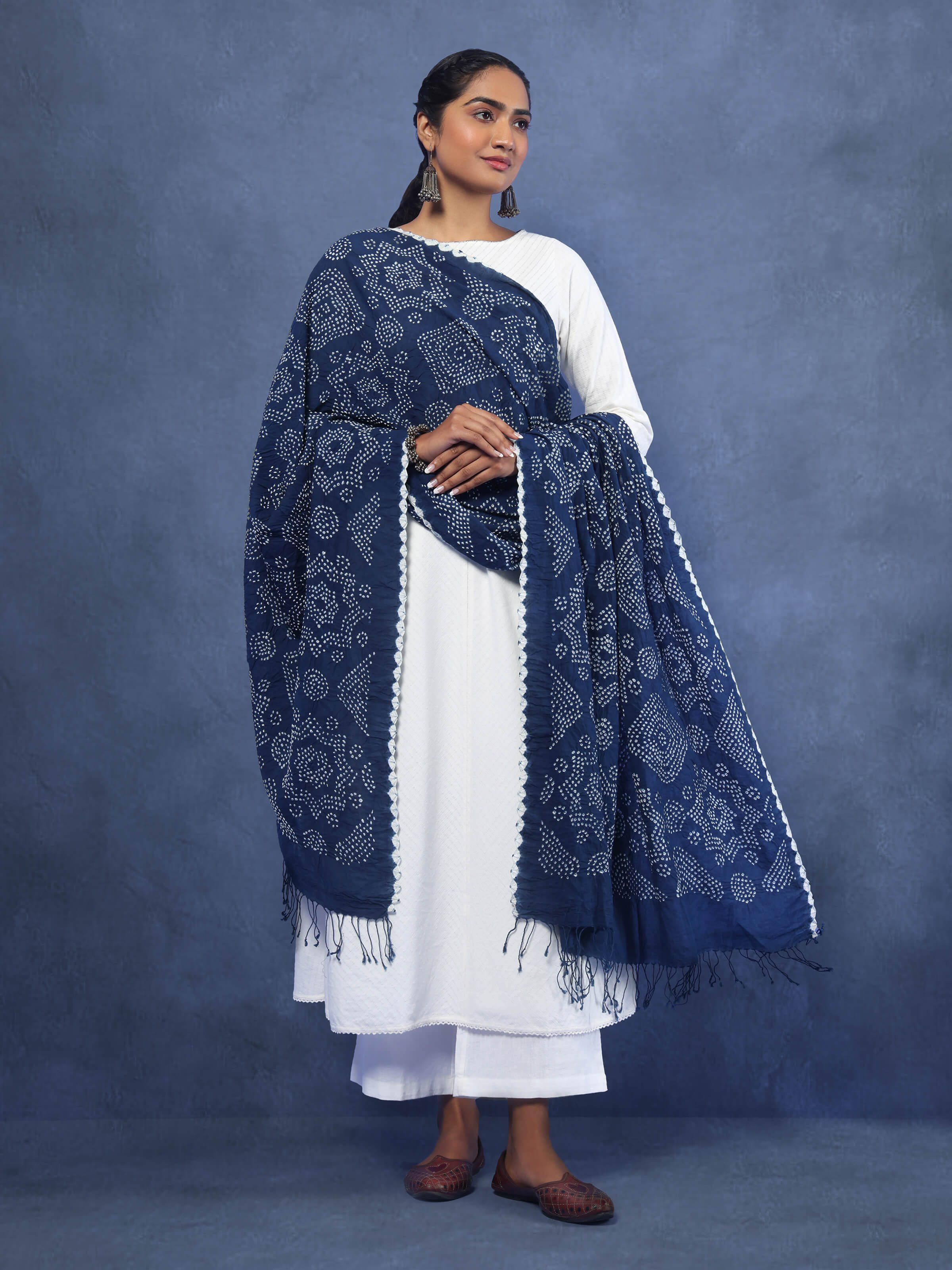 Lifestyle image of cotton Bandhani tie-dye dupatta draped elegantly with traditional attire