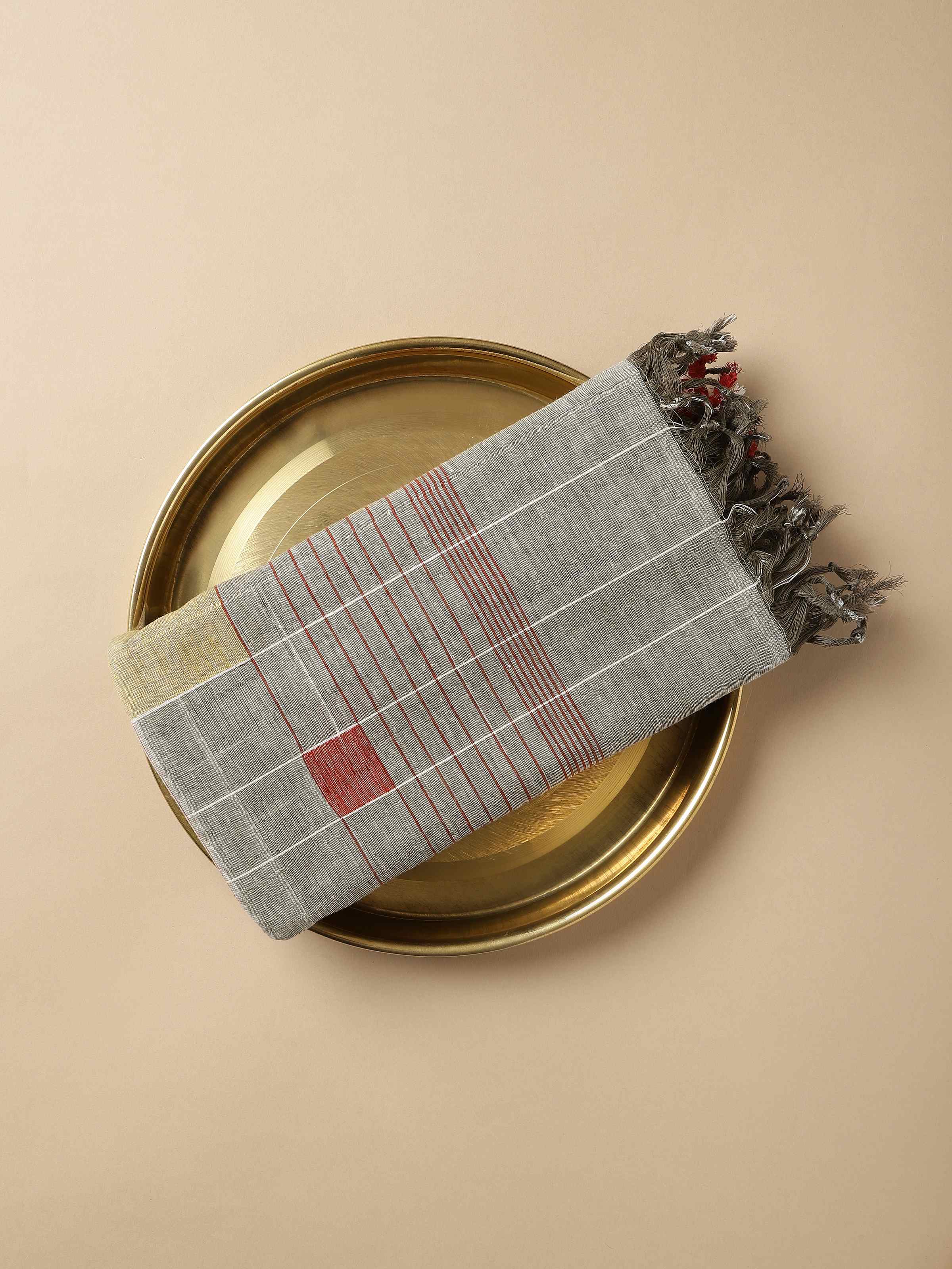 Close-up of the texture, highlighting the artisanal weaving and muted grey tone.