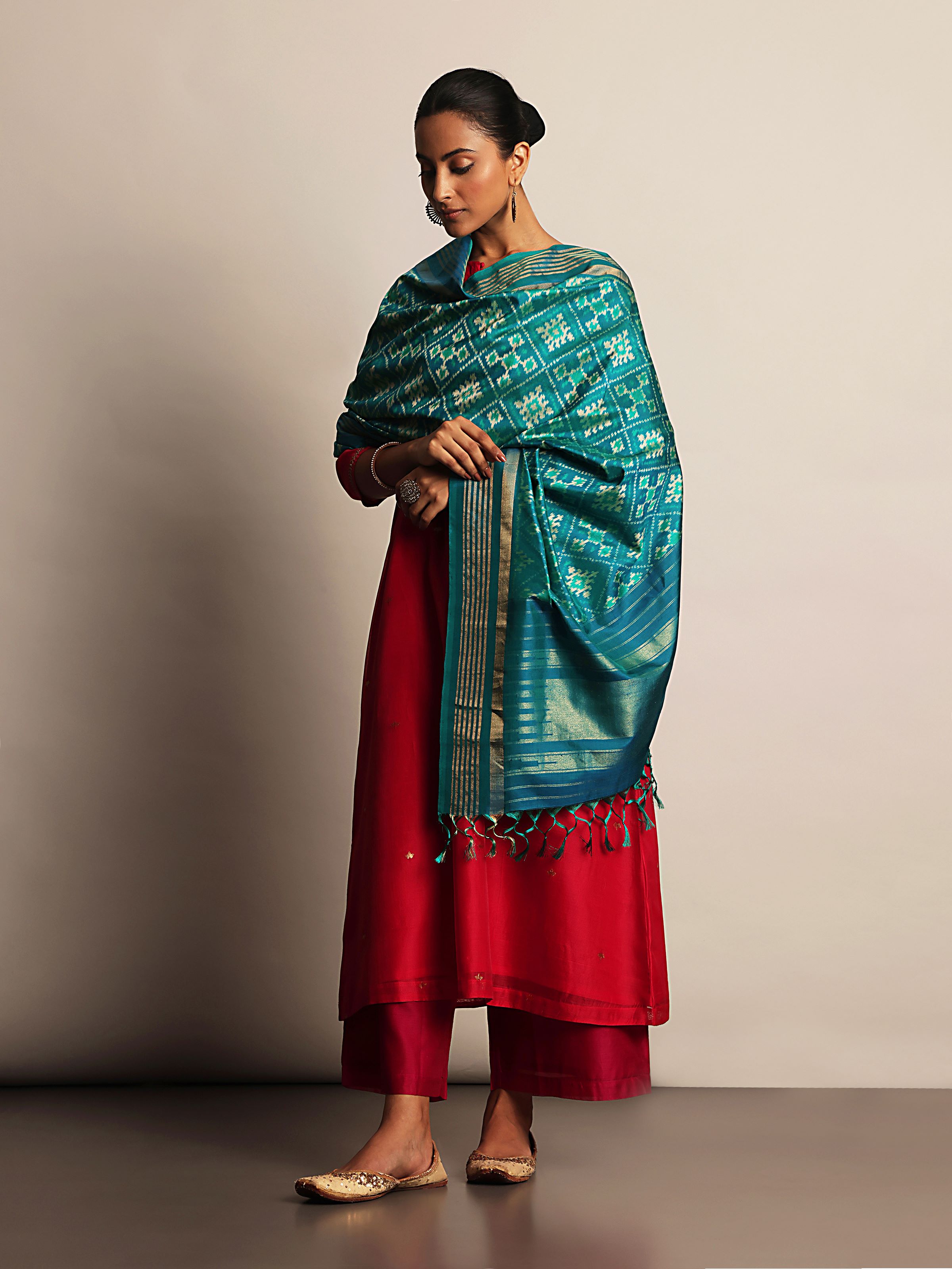 Lifestyle view of blue and gold Ikat silk dupatta styled with ethnic wear for a festive look