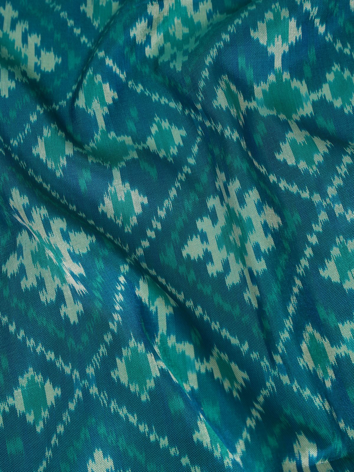 Detail view of blue and gold silk Ikat dupatta highlighting woven patterns and zari intricacy