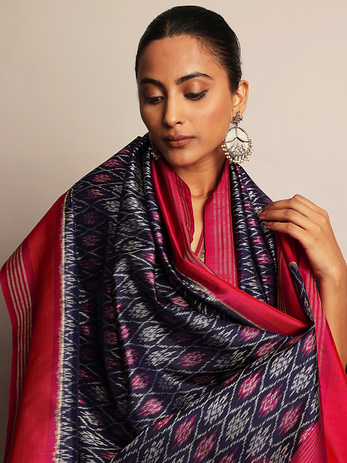 Detailed view of woven Ikat pattern and shimmering zari finish.