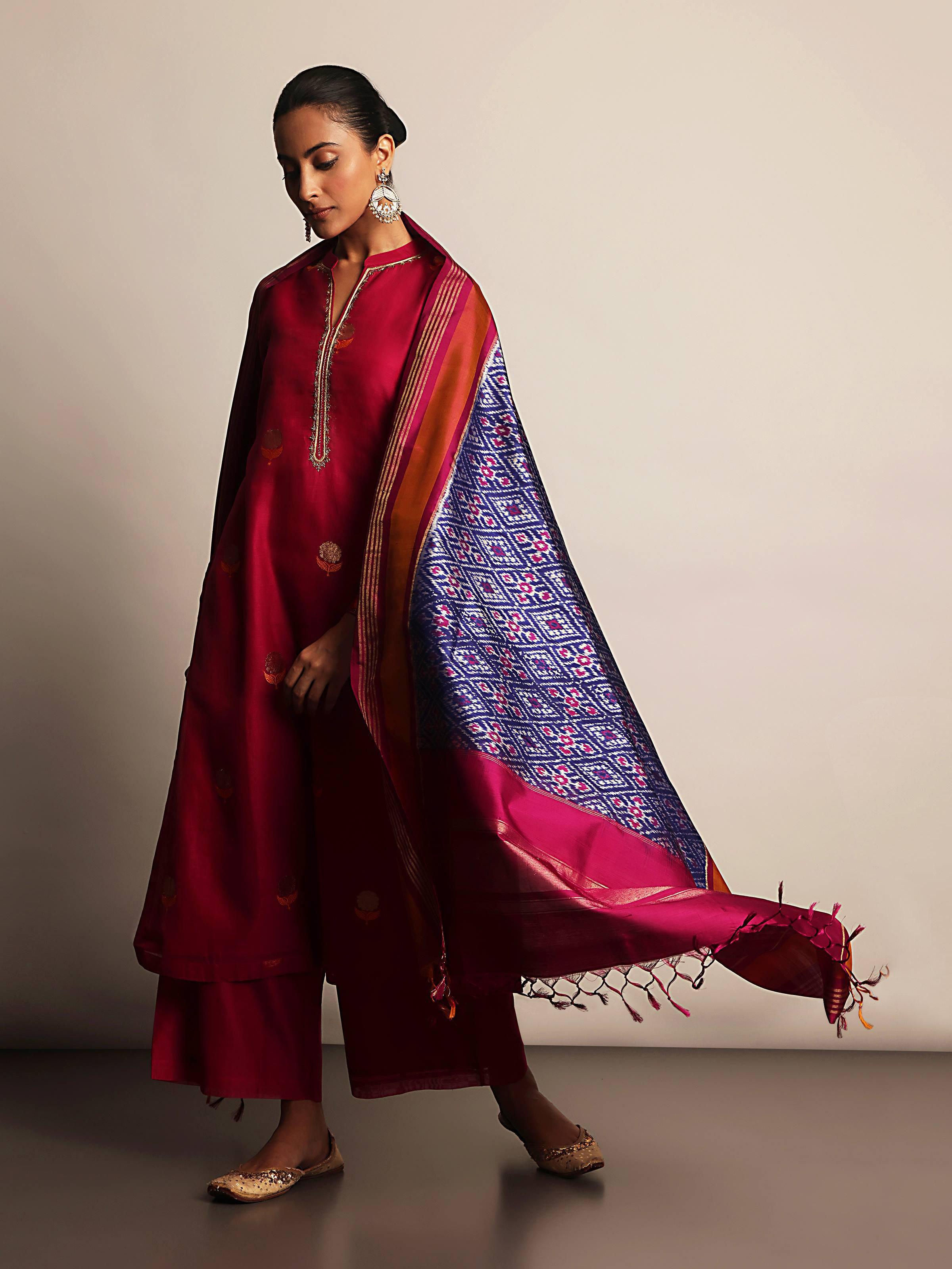 Close-up of blue and pink silk Ikat dupatta highlighting zari embroidery and vibrant Ikat patterns.