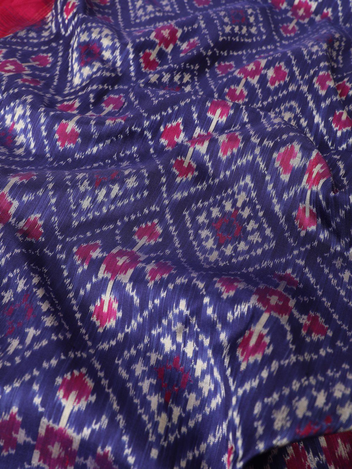 Draped blue and pink silk Ikat dupatta with zari work, emphasizing the texture and sheen of the fabric.