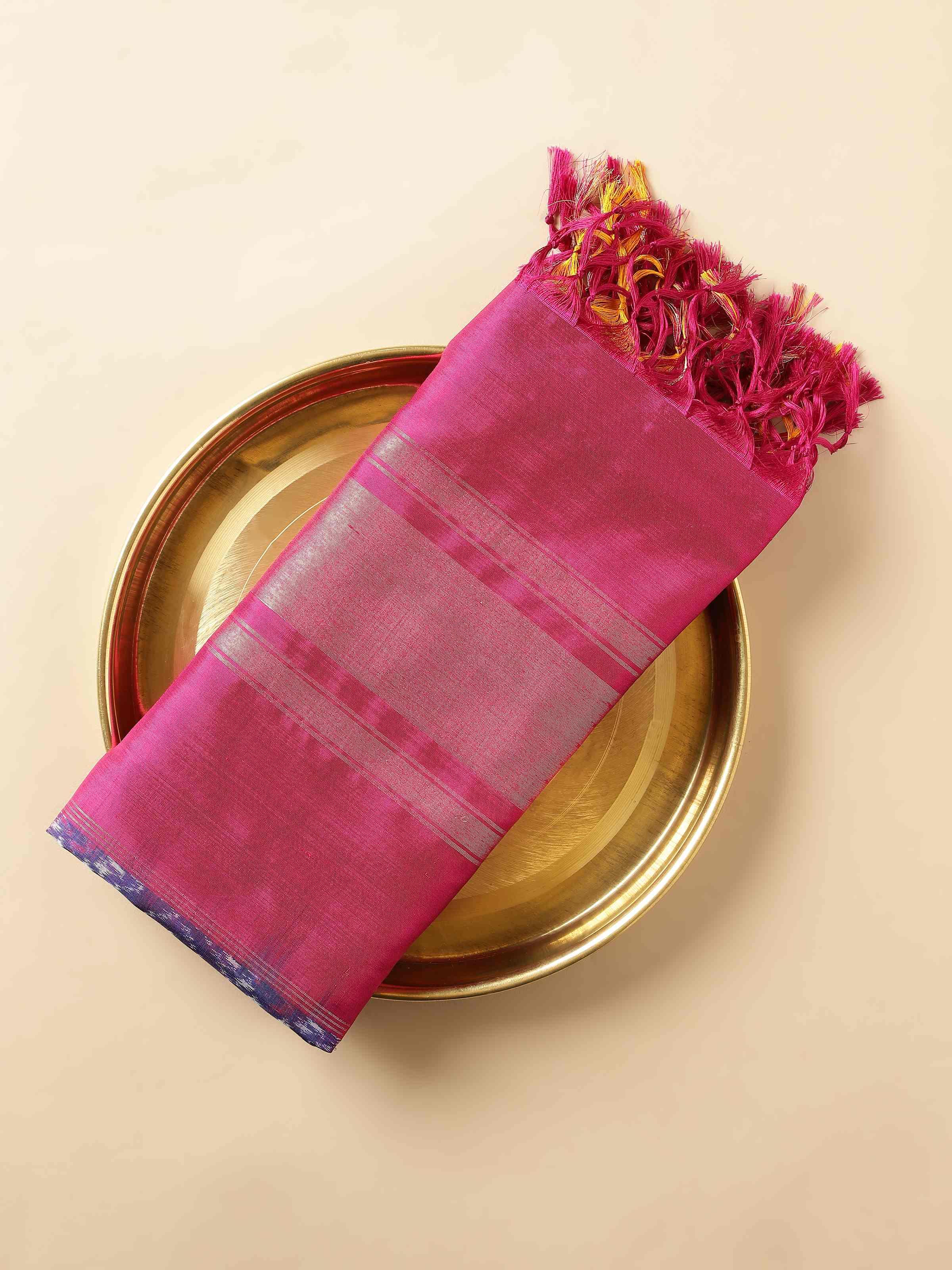 Folded blue and pink silk Ikat dupatta with golden zari patterns visible along the edges.