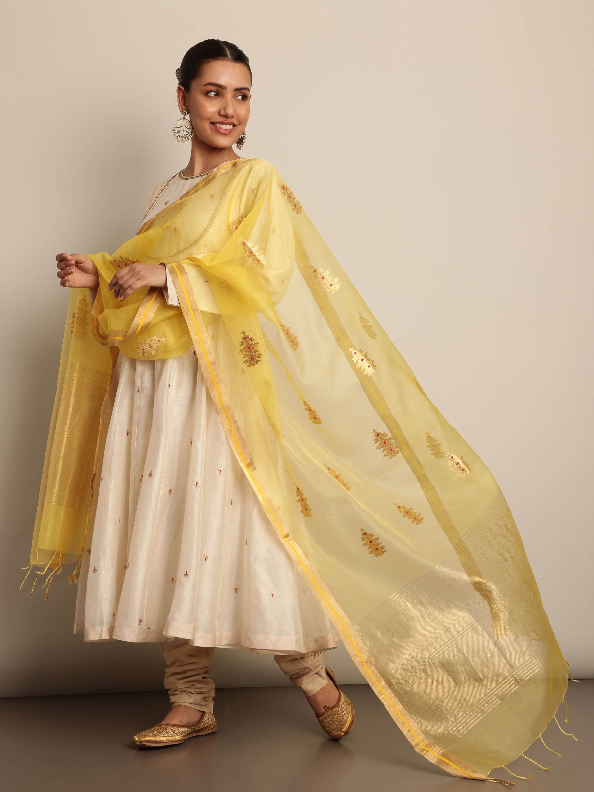 Lifestyle view of model styling yellow cotton silk Chanderi dupatta