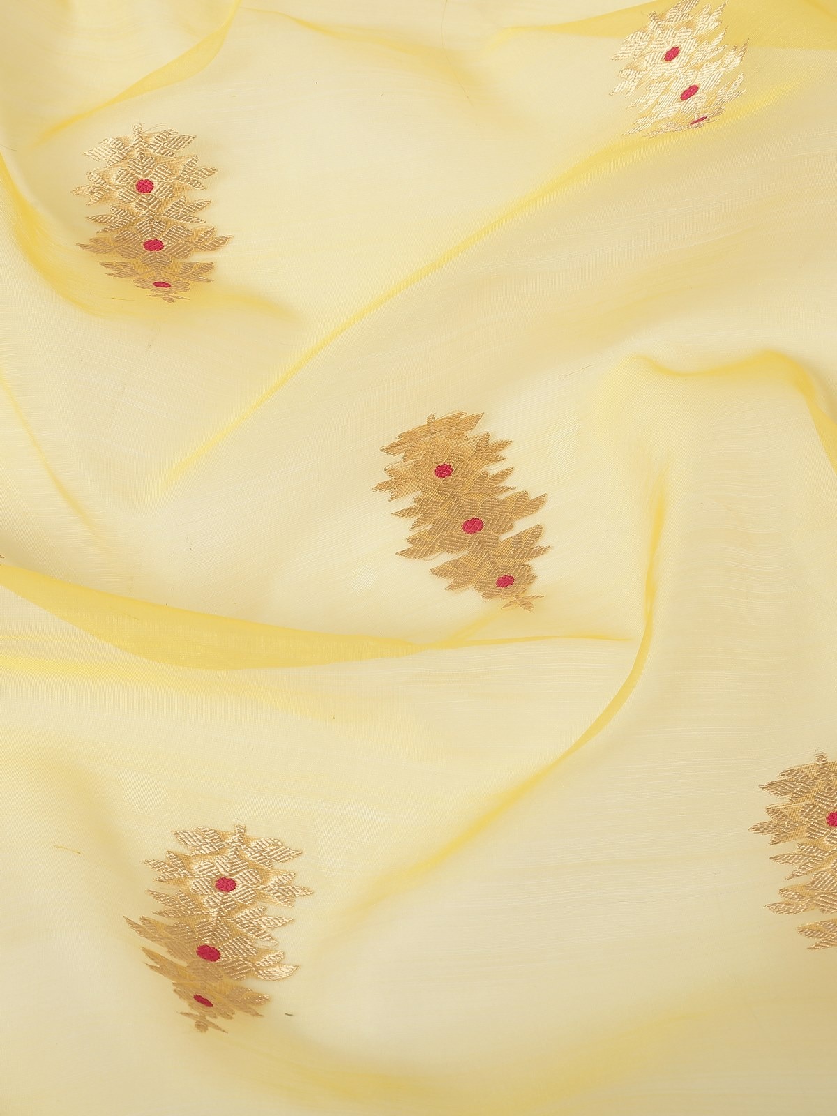 Detail view of golden zari weave and cotton silk blend in yellow dupatta