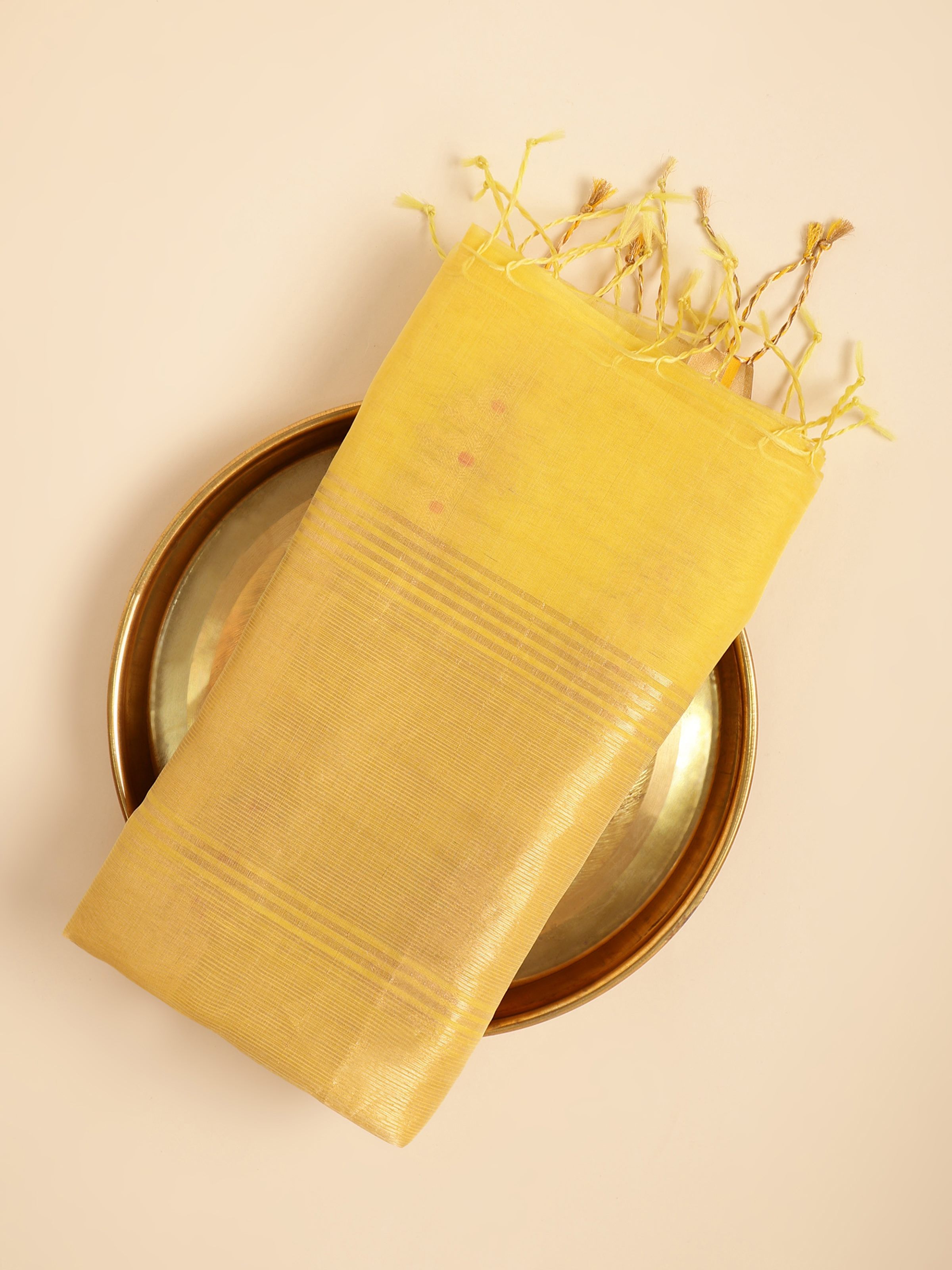 Close-up corner view showing fabric finish of yellow Chanderi dupatta