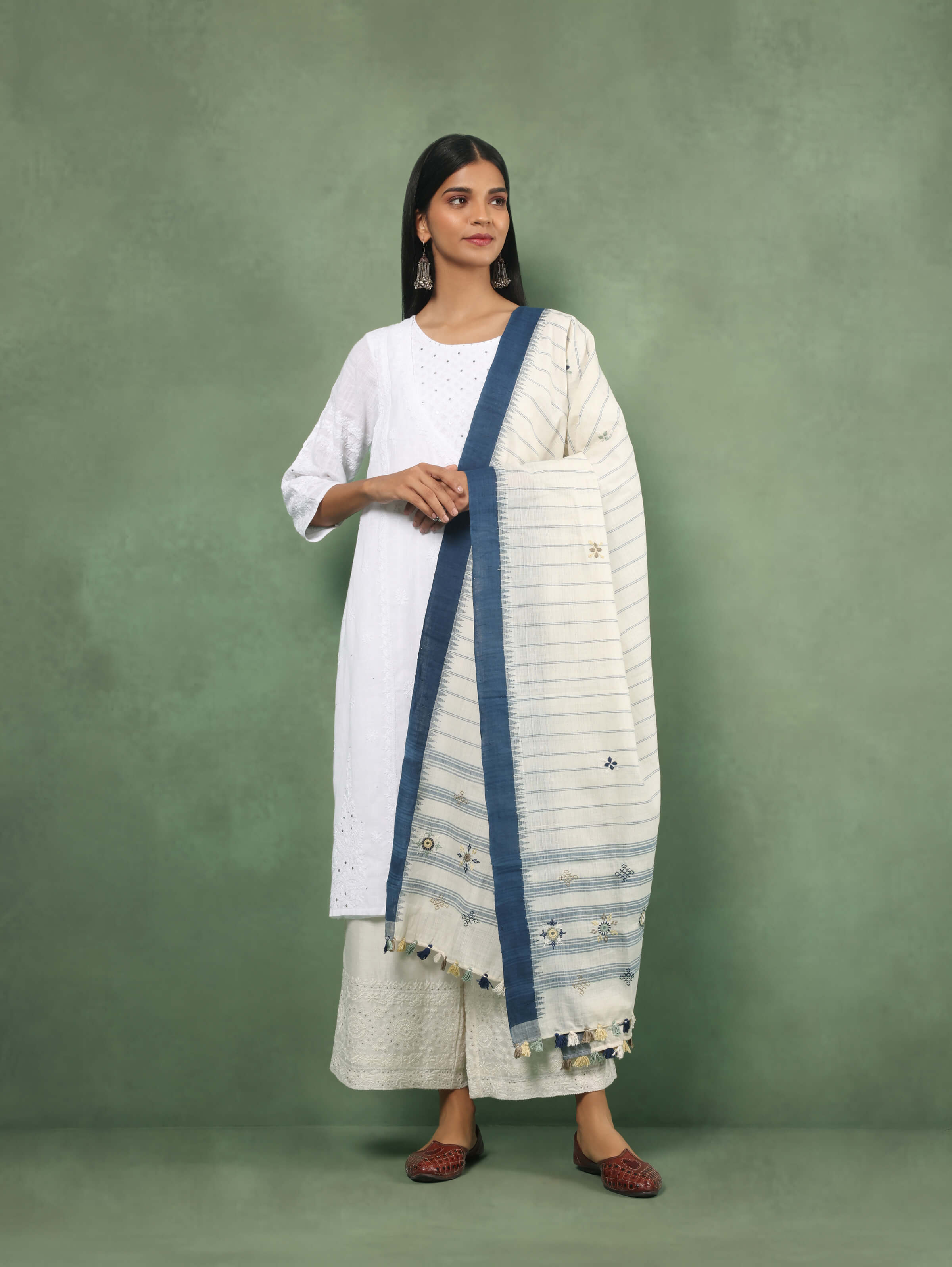 Lifestyle shot of blue cotton Lambani embroidered dupatta draped stylishly to highlight embroidery.