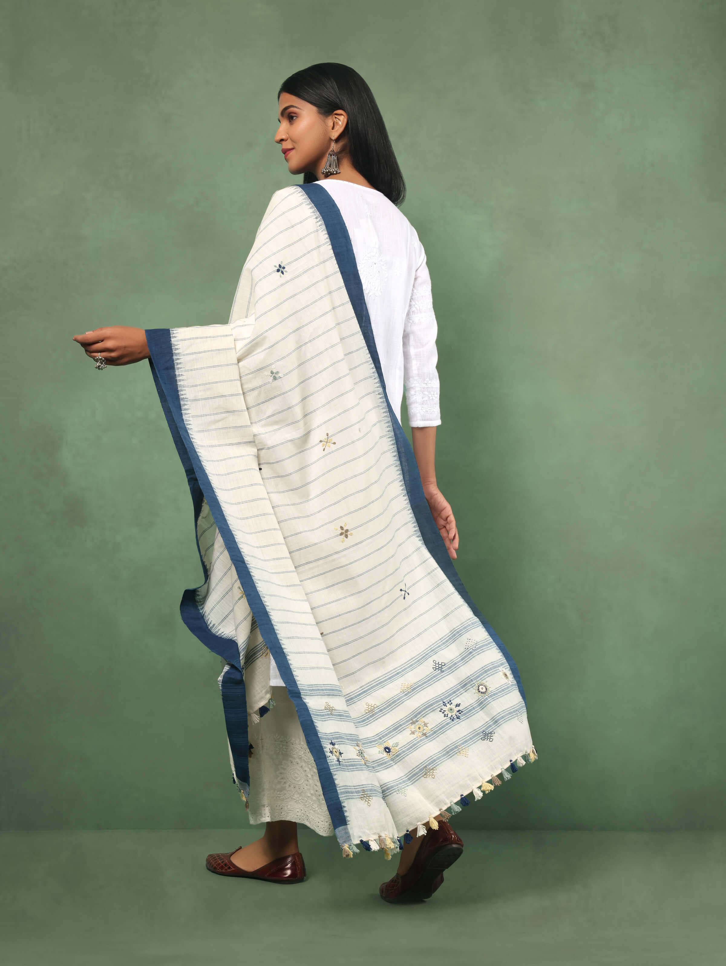 Angled view of blue cotton Lambani dupatta showing detailed hand embroidery and fabric texture.