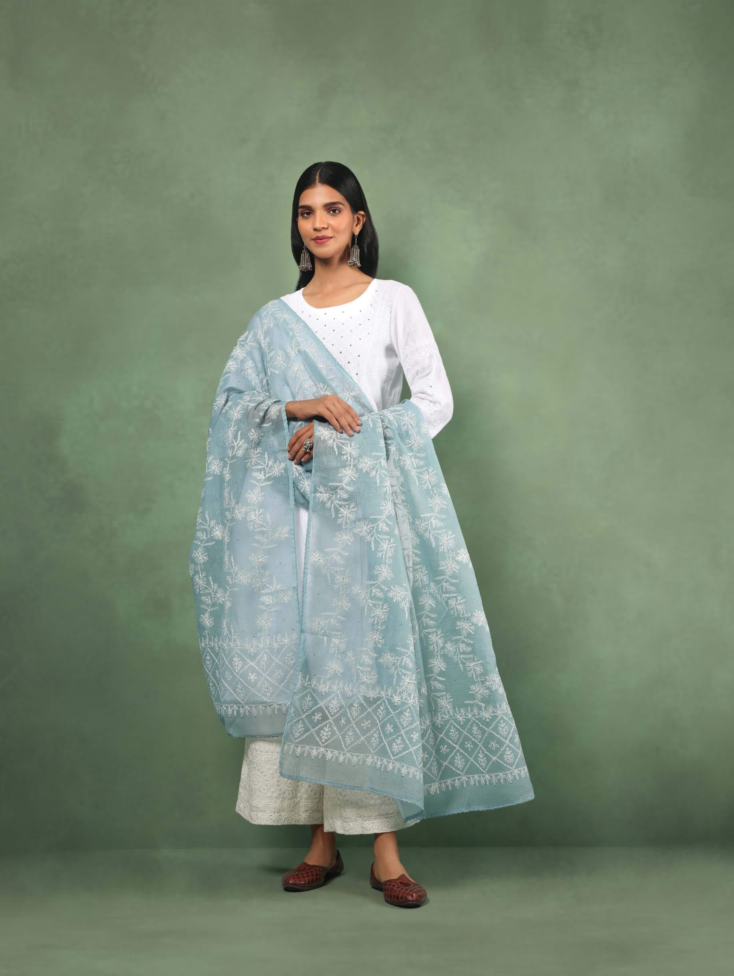Lifestyle view of model styling aqua Chikankari dupatta with white kurta set